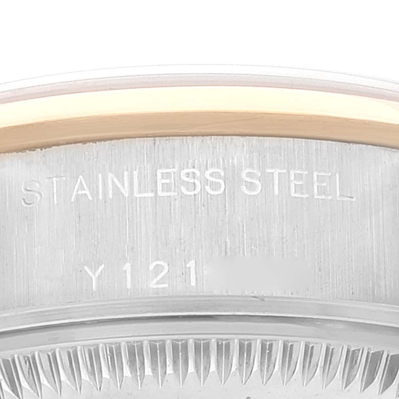 This image shows a close-up view of the stainless steel case back edge and serial number of a Rolex Datejust 79163 Women's Steel and Gold (two tone) Grey Dial 79163 Women's Steel and Gold (two tone) Grey Dial watch.