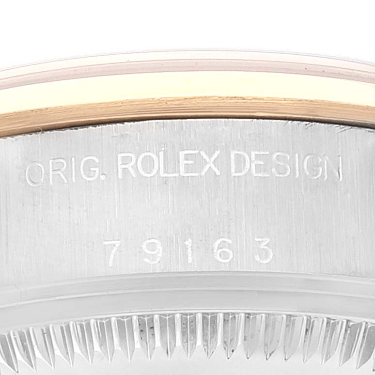 The image shows a close-up of the side engraving on a Rolex Datejust 79163 Women's Steel and Gold (two tone) Grey Dial 79163 Women's Steel and Gold (two tone) Grey Dial watch case, featuring the model number 79163.