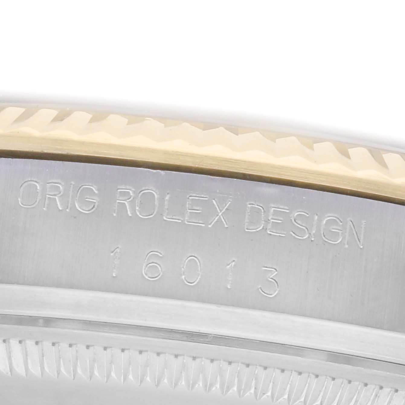 The image shows the case side of the Vintage Collection Rolex, highlighting the engraved design and model number.