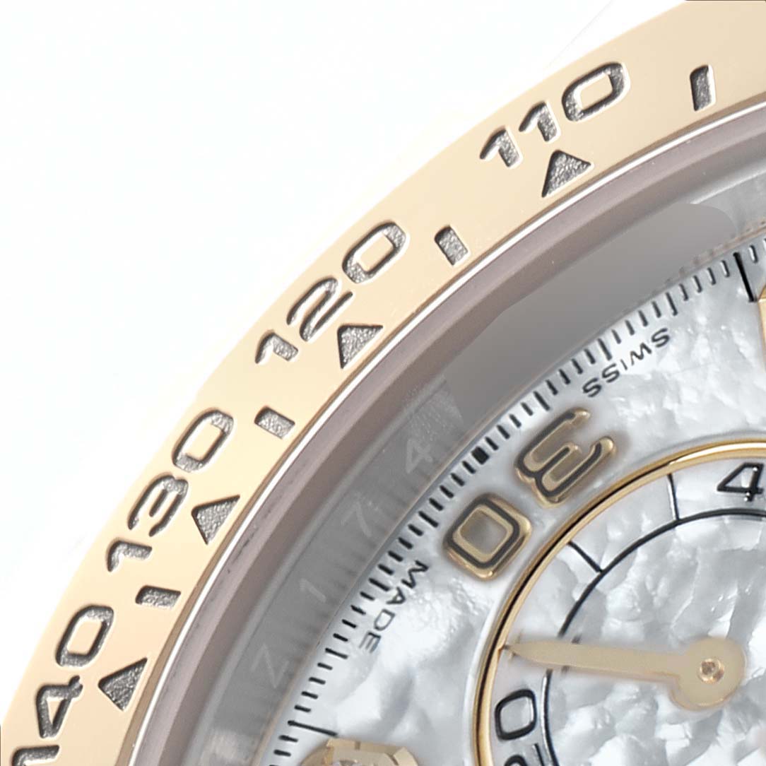 The image shows a close-up of the bezel and partial dial of a Rolex Daytona 116503 Men
s Steel and Gold (two tone) Mother of Pearl Dial 116503 Men
s Steel and Gold (two tone) Mother of Pearl Dial, highlighting the tachymetric scale and subdial.