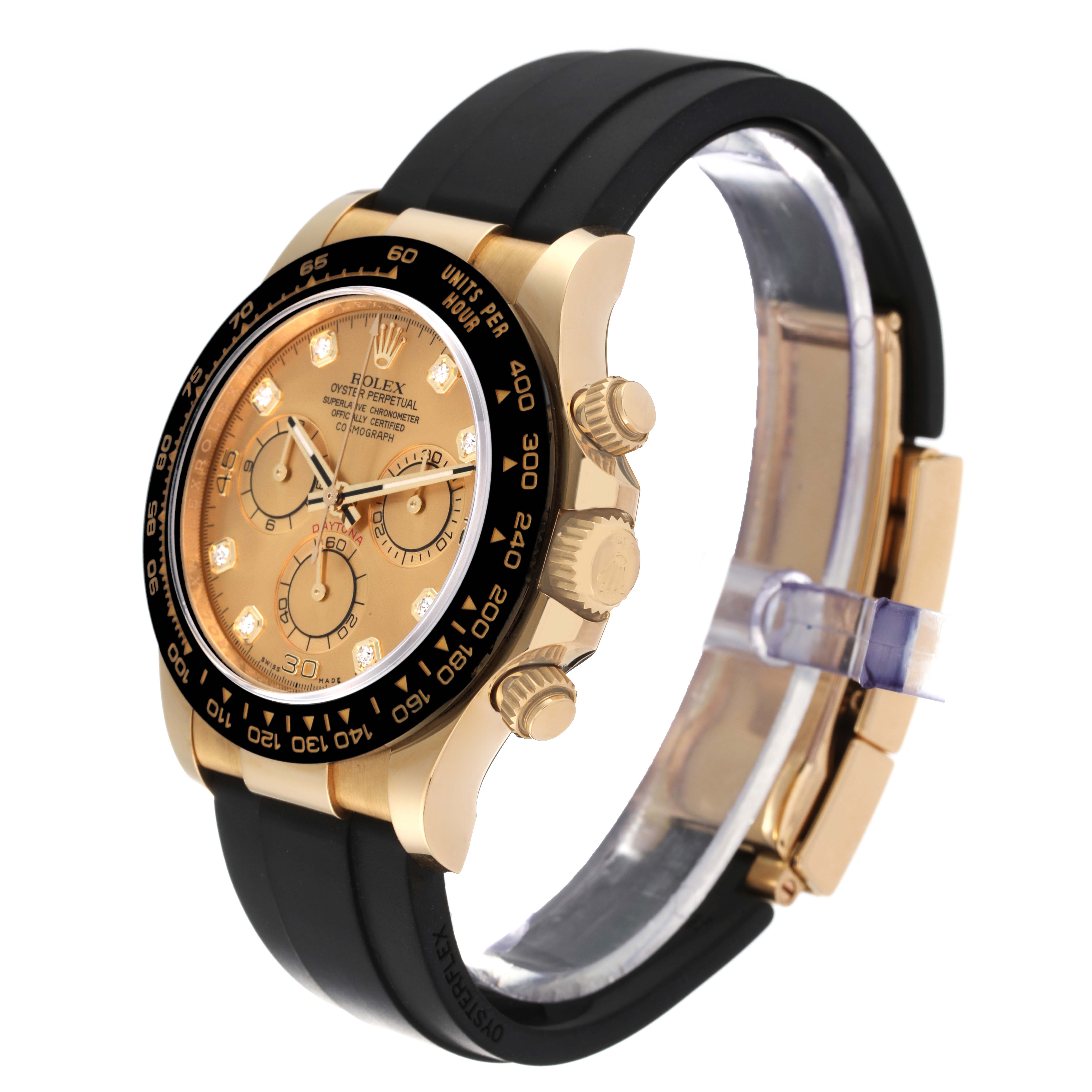 The Rolex Daytona 116518 Men's Yellow Gold Champagne Dial 116518 Men's Yellow Gold Champagne Dial watch is shown at an oblique angle, displaying its gold case, black bezel, black strap, and chronograph subdials.