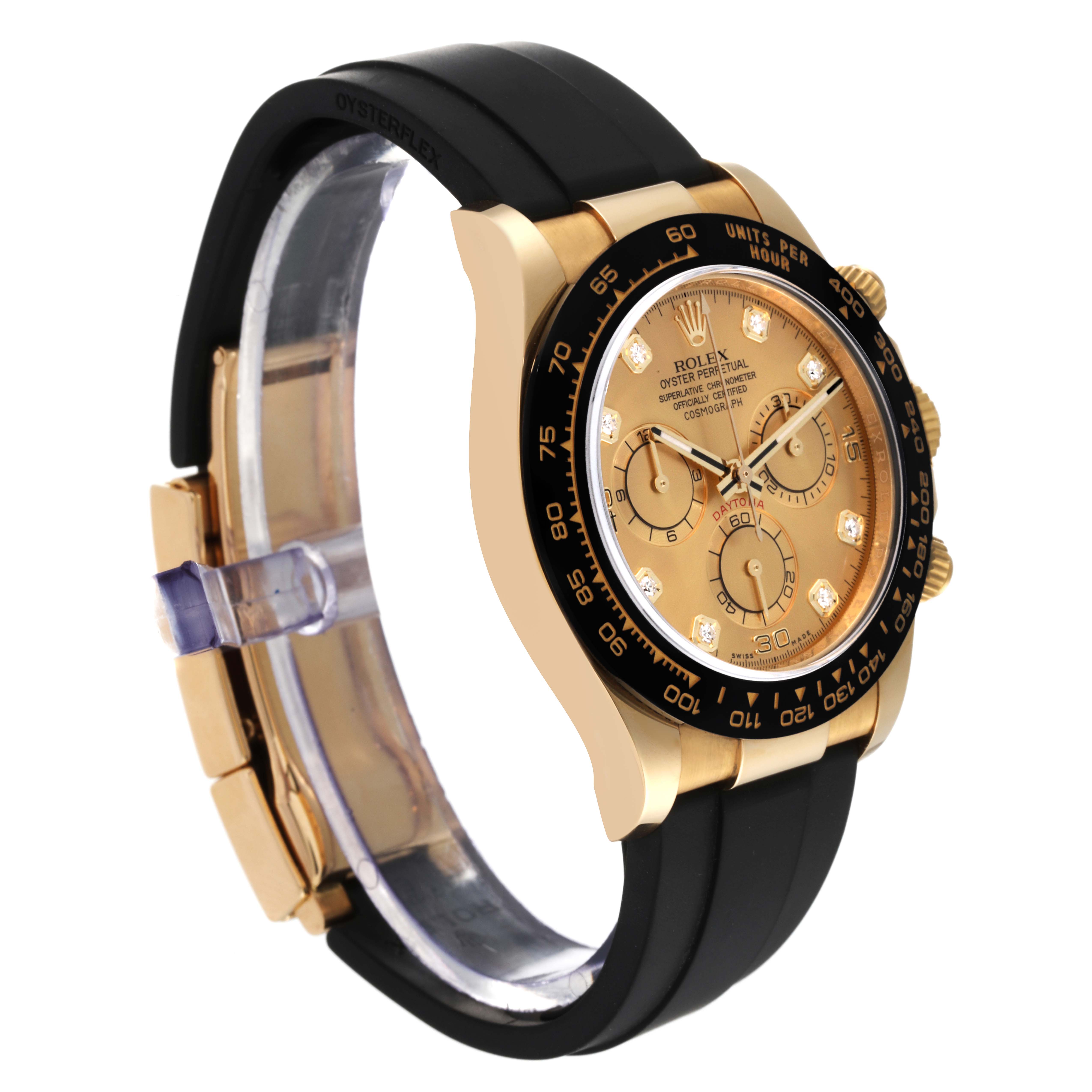 The image shows a side angle of a Rolex Daytona 116518 Men's Yellow Gold Champagne Dial 116518 Men's Yellow Gold Champagne Dial with a gold dial and black rubber strap.