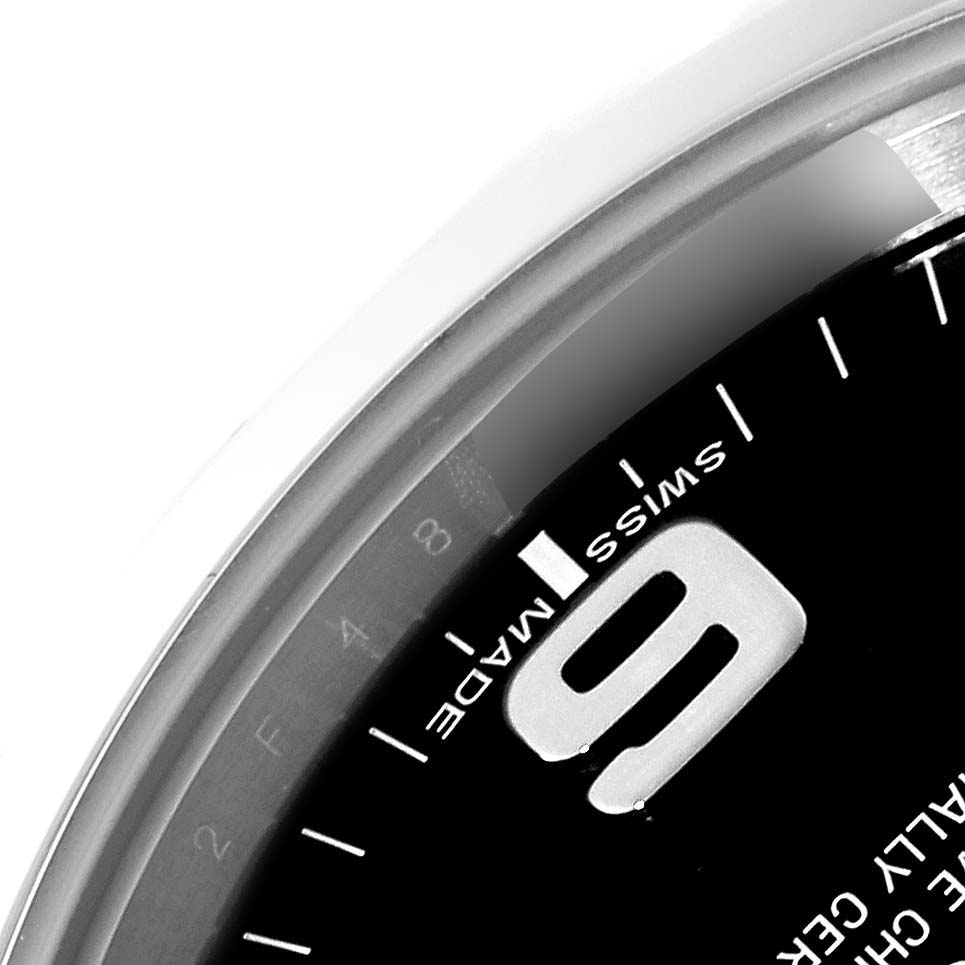 The image shows a close-up of the dial of the Rolex Explorer 214270 Men
s Stainless Steel Black Dial 214270 Men
s Stainless Steel Black Dial, featuring the number 9 and "Swiss Made" text.