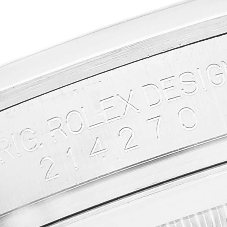 The image shows a close-up of the engraved reference number on the case of a Rolex Explorer 214270 Men
s Stainless Steel Black Dial 214270 Men
s Stainless Steel Black Dial model watch.