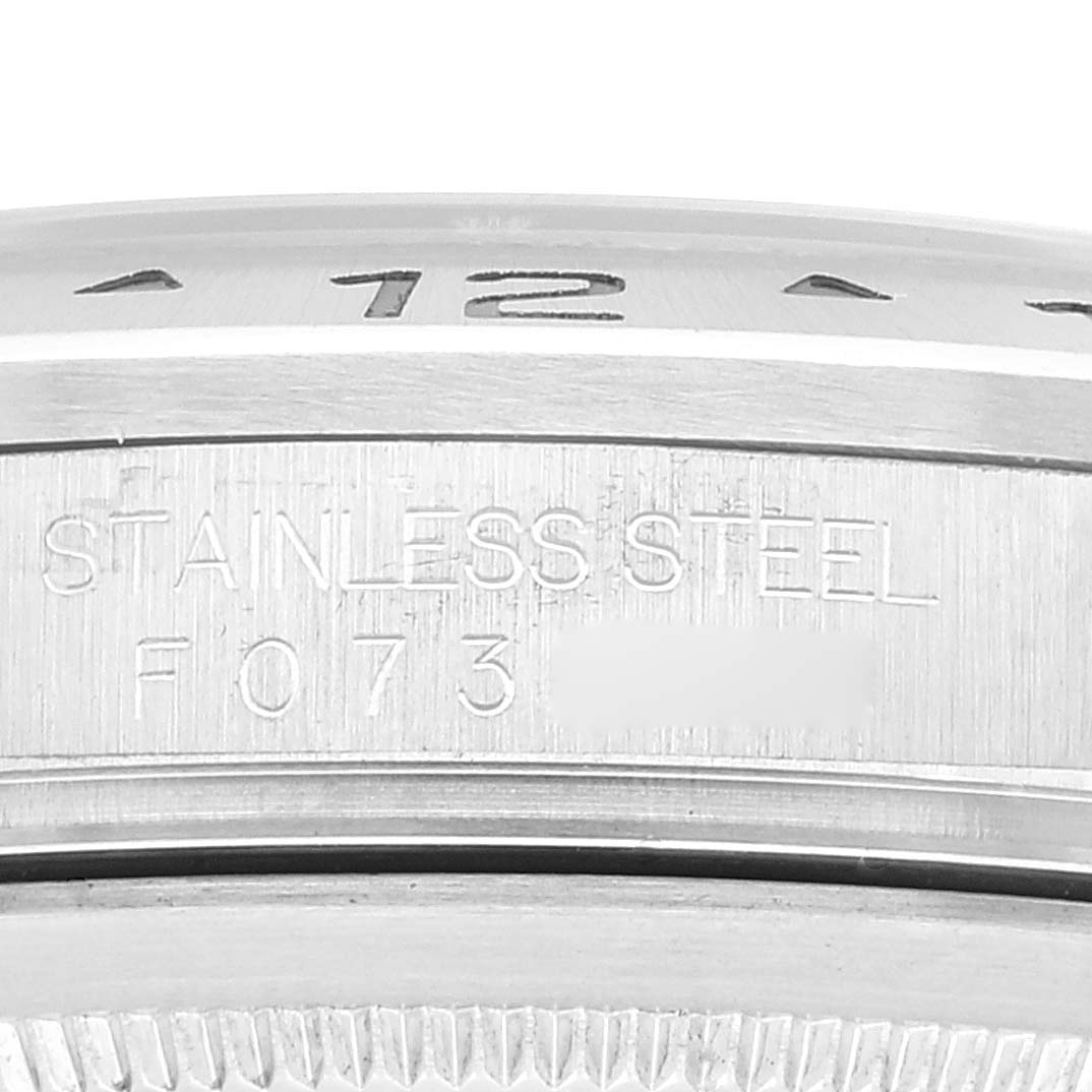 The image shows a close-up of the bezel and case of a Rolex Explorer 16570 Men's Stainless Steel White Dial 16570 Men's Stainless Steel White Dial watch, highlighting the "STAINLESS STEEL" engraving.