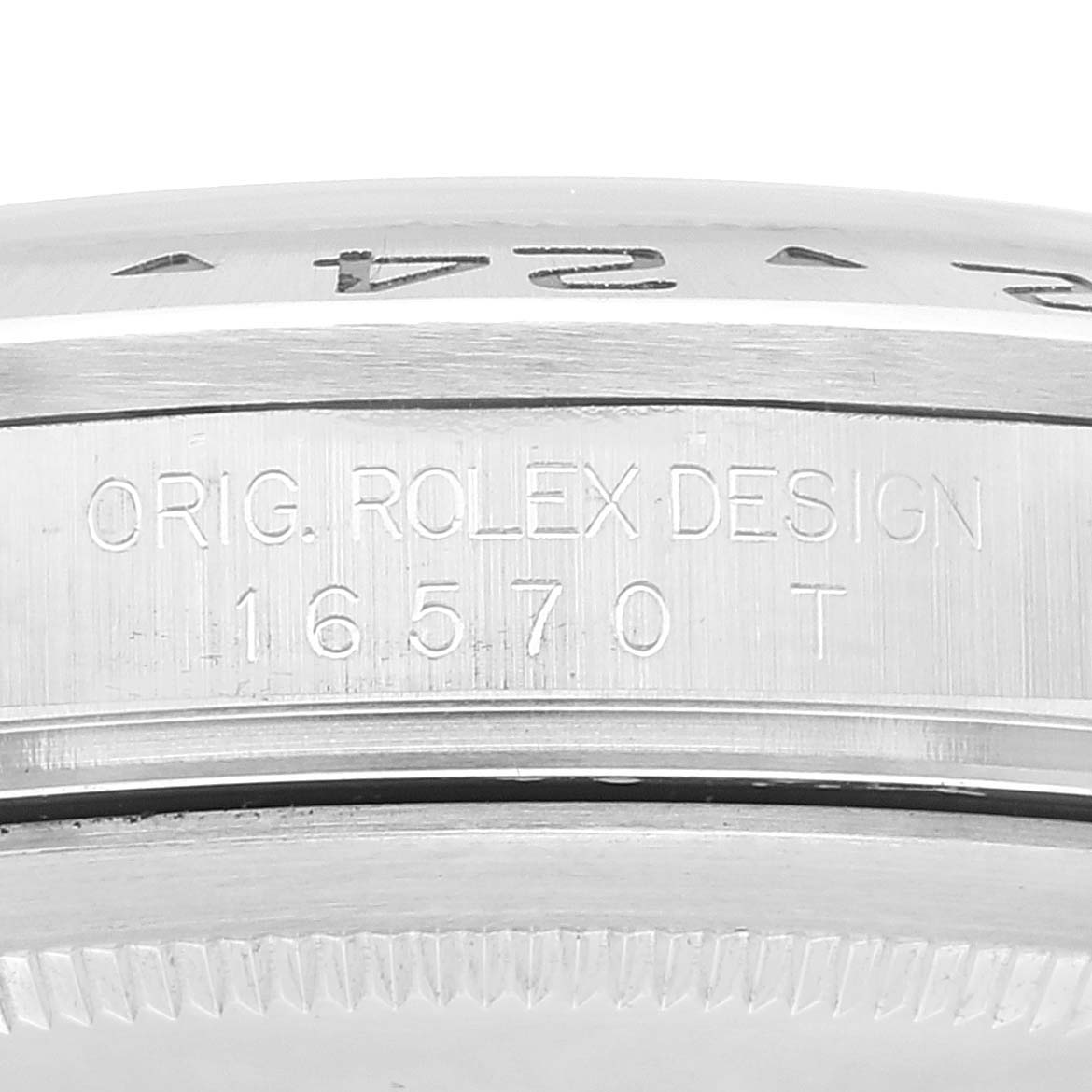 The image shows a close-up of the side of a Rolex Explorer 16570 Men's Stainless Steel White Dial 16570 Men's Stainless Steel White Dial watch case with the model number 16570 T engraved.