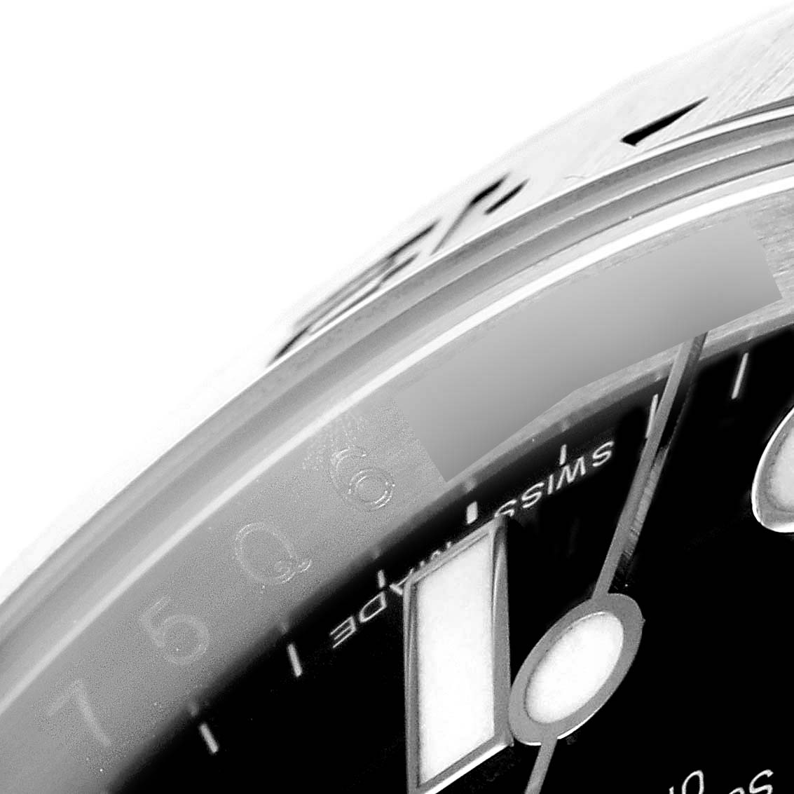 The image shows a close-up of the Rolex Explorer 216570 Men's Stainless Steel Black Dial 216570 Men's Stainless Steel Black Dial watch's dial and bezel, highlighting the "Swiss" marking and part of the 6.