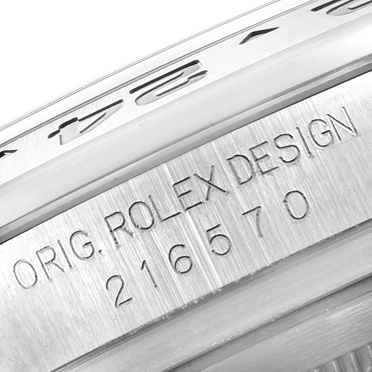 This image shows a close-up angle of the Rolex Explorer 216570 Men's Stainless Steel Black Dial 216570 Men's Stainless Steel Black Dial model, focusing on the engraved serial number and bezel.