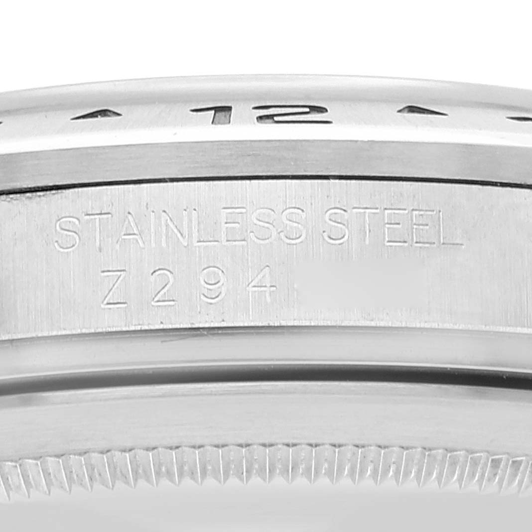 This image shows a close-up of the stainless steel casing and bezel of a Rolex Explorer 16570 Men
s Stainless Steel Black Dial 16570 Men
s Stainless Steel Black Dial model, highlighting the engraved serial number Z294.