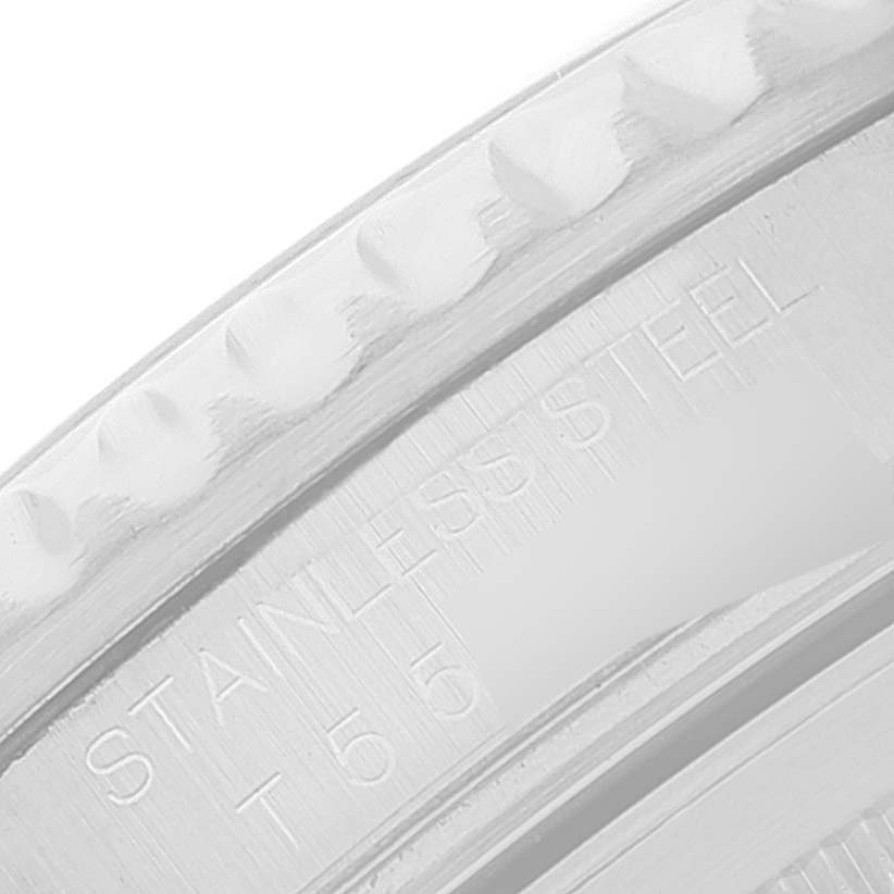 The image shows a close-up of the engraved bezel and inner ring of a Rolex GMT-Master 16710 Men's Stainless Steel Black Dial 16710 Men's Stainless Steel Black Dial watch, highlighting "STAINLESS STEEL" text.