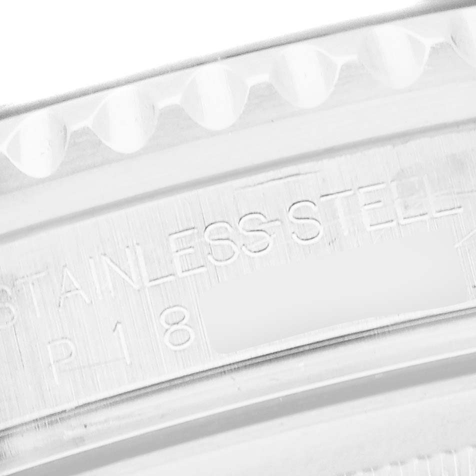 The image shows a close-up of the stainless steel bezel edge on a Rolex GMT-Master 16710 Men
s Stainless Steel Black Dial 16710 Men
s Stainless Steel Black Dial watch.