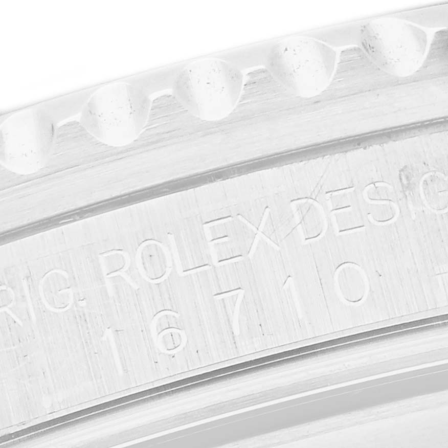 The image shows a close-up of the engraving on the case side of a Rolex GMT-Master 16710 Men
s Stainless Steel Black Dial 16710 Men
s Stainless Steel Black Dial, including the model number.