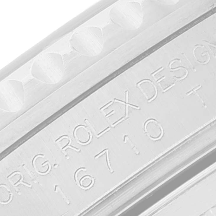 The image shows a close-up view of the model and brand engraving on the casing of a Rolex GMT-Master 16710 Men's Stainless Steel Black Dial 16710 Men's Stainless Steel Black Dial watch.