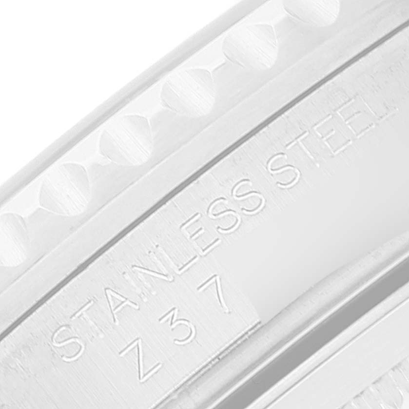 This image shows a close-up of the side engraving on the stainless steel case of a Rolex GMT-Master 16710 Men's Stainless Steel Black Dial 16710 Men's Stainless Steel Black Dial watch.