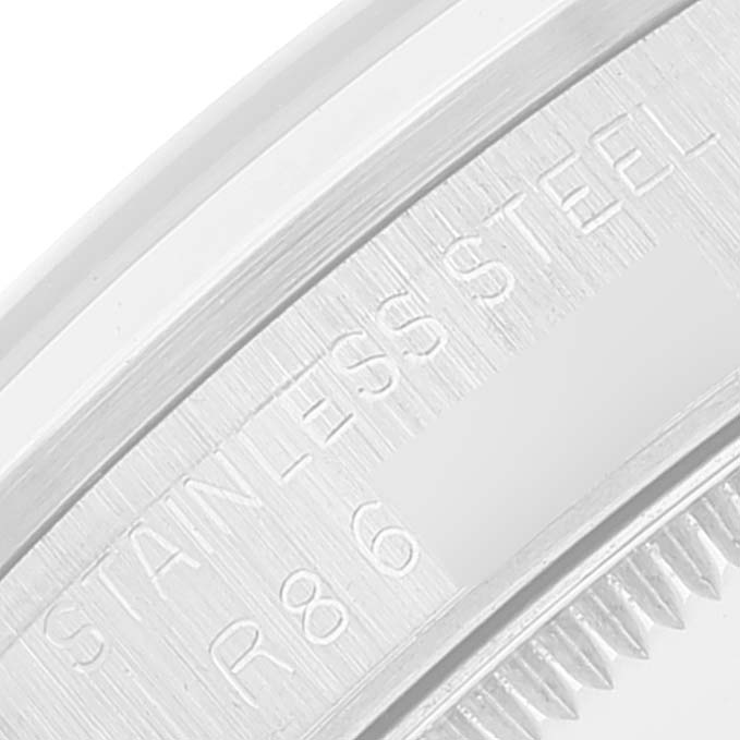 This is a close-up image showing the edge and stainless steel inscription of a Rolex Mid-Size 68240 Women
s Stainless Steel Blue Dial 68240 Women
s Stainless Steel Blue Dial model watch.