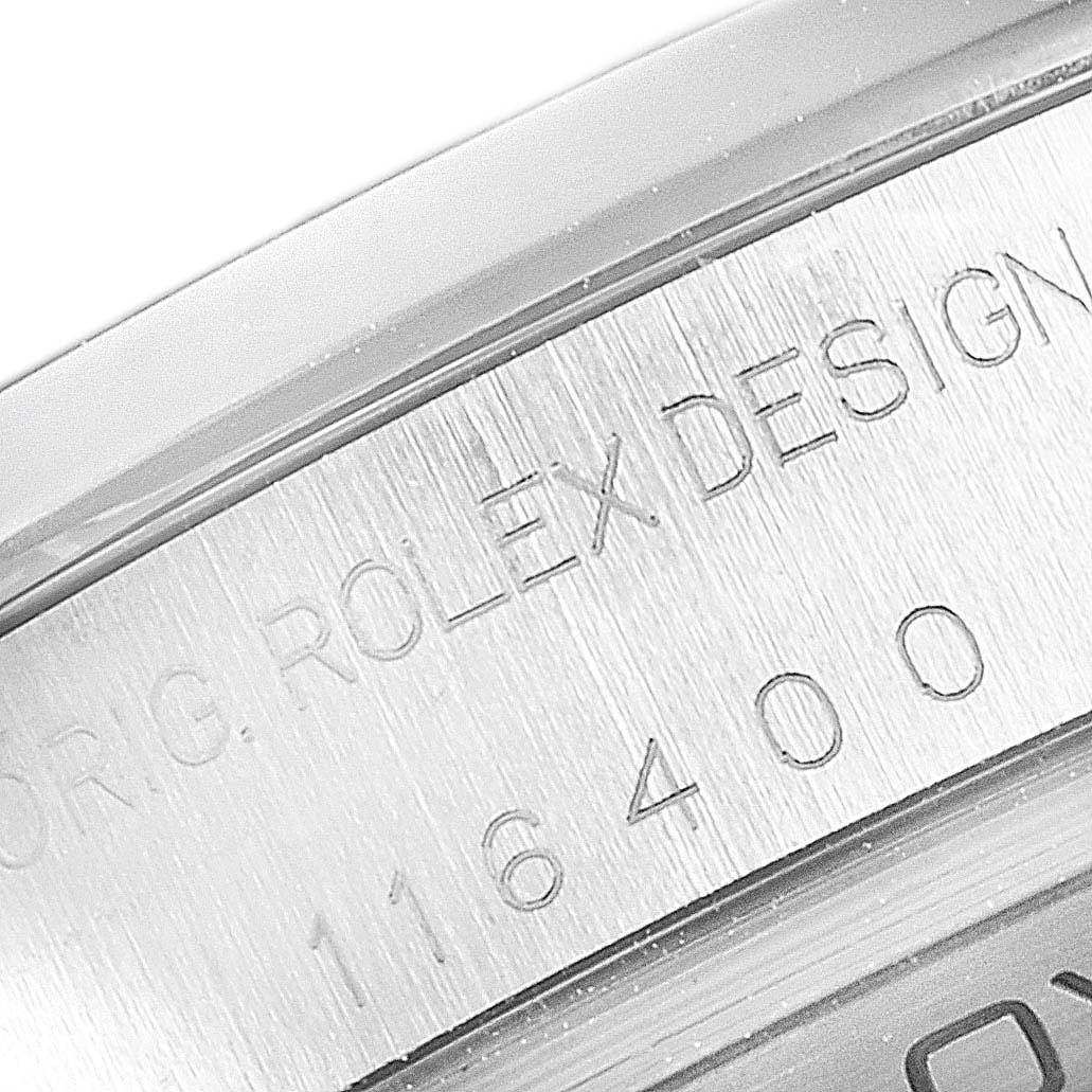 Close-up of the engravings on a Rolex Milgauss 116400V Men's Stainless Steel White Dial 116400V Men's Stainless Steel White Dial watch case, showing "ROLEX DESIGN" and the model number.