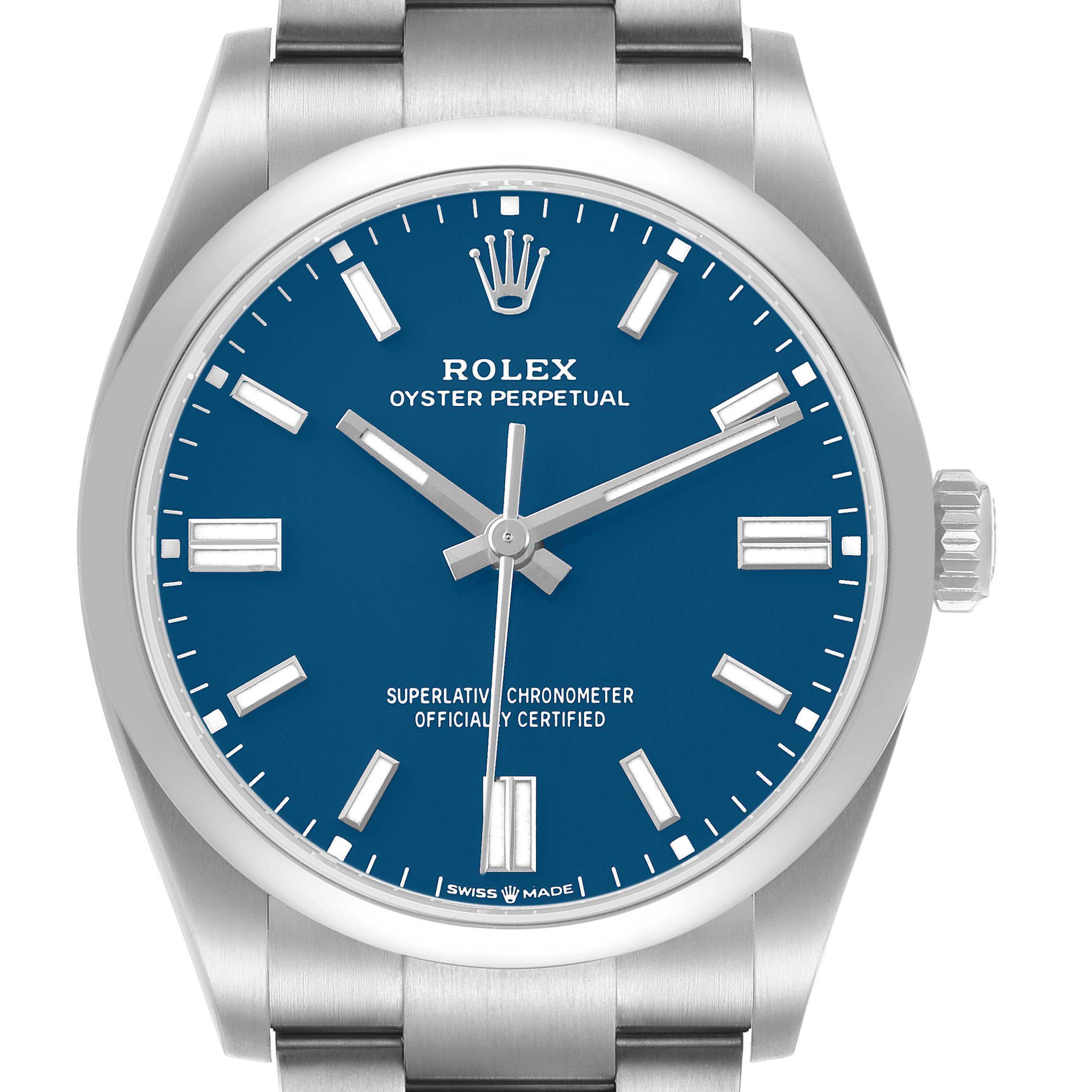 The image shows a frontal view of the Rolex Oyster Perpetual 126000 Men's Stainless Steel Blue Dial watch, highlighting the blue dial, indices, and crown.
