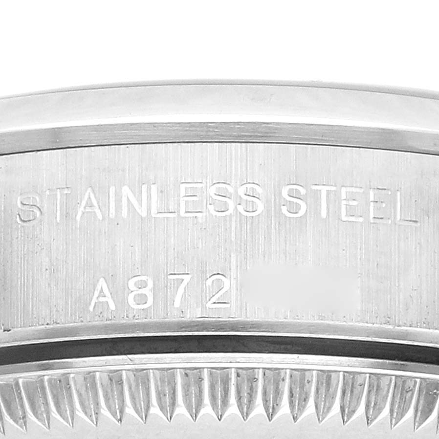 The image shows a close-up of the stainless steel back casing and model engraving of a Rolex Oyster Perpetual 76080 Women
s Stainless Steel Blue Dial 76080 Women
s Stainless Steel Blue Dial watch.