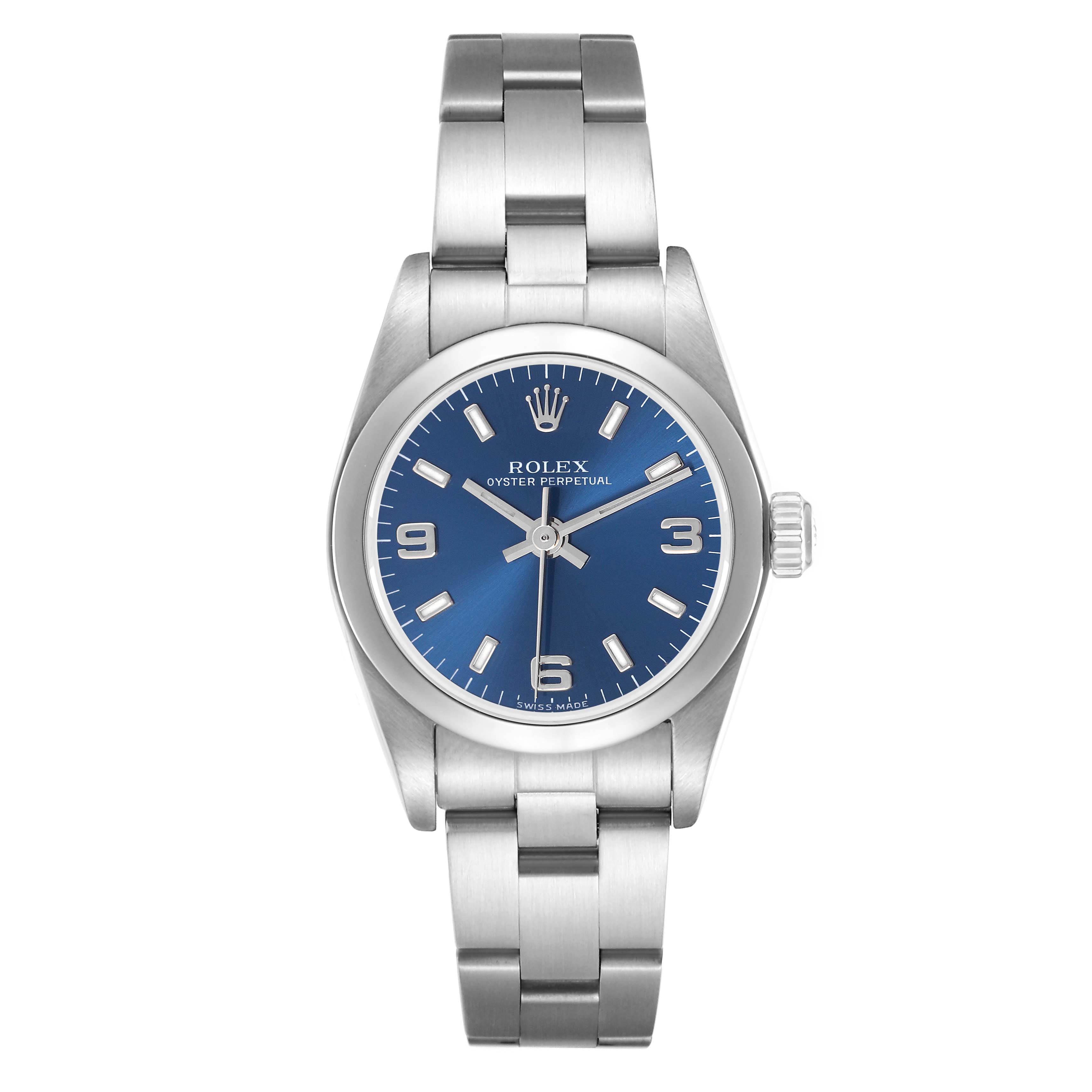 The image shows a Rolex Oyster Perpetual 76080 Women
s Stainless Steel Blue Dial 76080 Women
s Stainless Steel Blue Dial watch from a front angle, highlighting its blue dial, markers, and stainless steel bracelet.