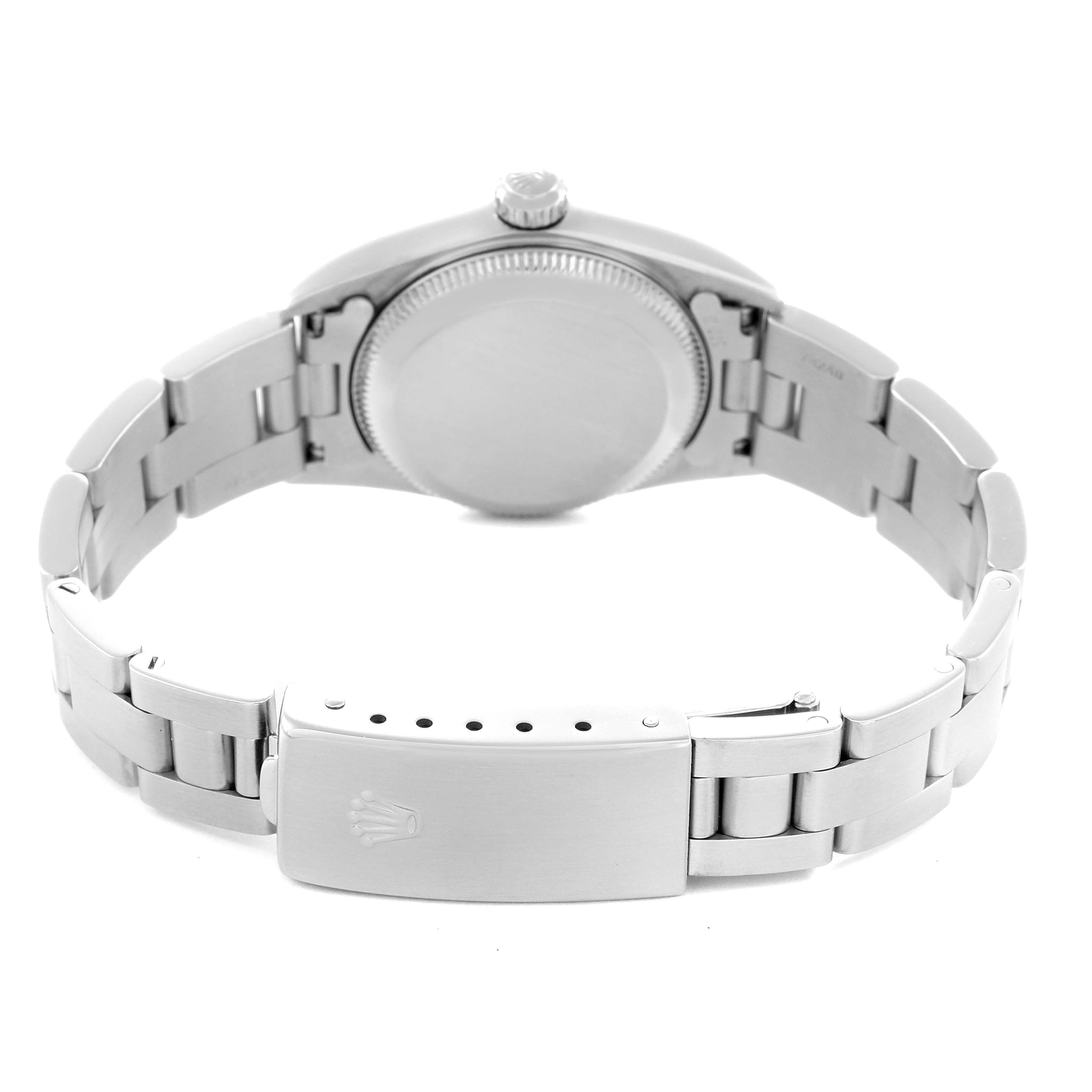 The Rolex Oyster Perpetual 76080 Women
s Stainless Steel Blue Dial 76080 Women
s Stainless Steel Blue Dial is shown from the back angle, highlighting its case back and bracelet clasp.