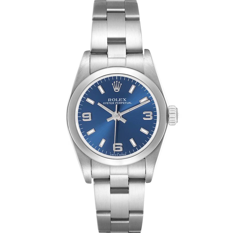 The Rolex Oyster Perpetual is shown from a front angle, highlighting its blue dial, indices, and stainless steel bracelet.