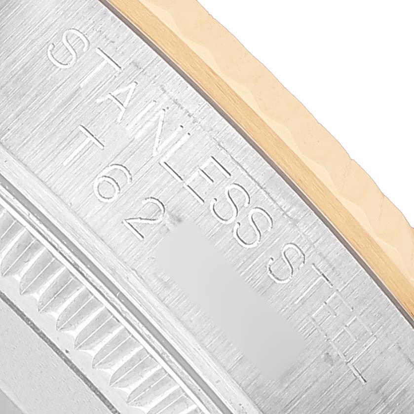 The image shows a close-up of the side of a Rolex Oyster Perpetual 67513 Women's Steel and Gold (two tone) White Dial, highlighting the stainless steel engraving.