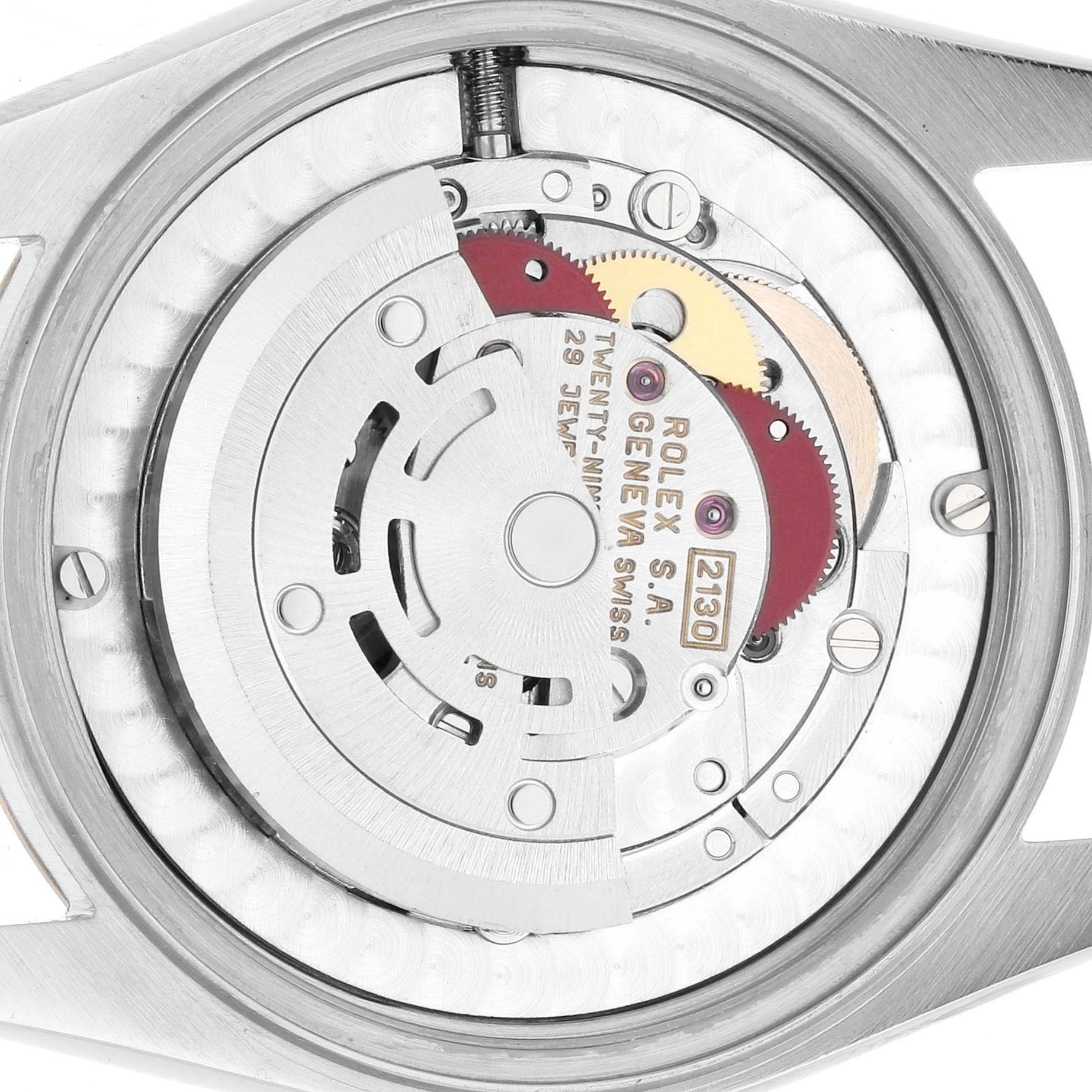 The image shows the back view of a Rolex Oyster Perpetual 67513 Women's Steel and Gold (two tone) White Dial, focusing on its intricate movement and mechanism components.