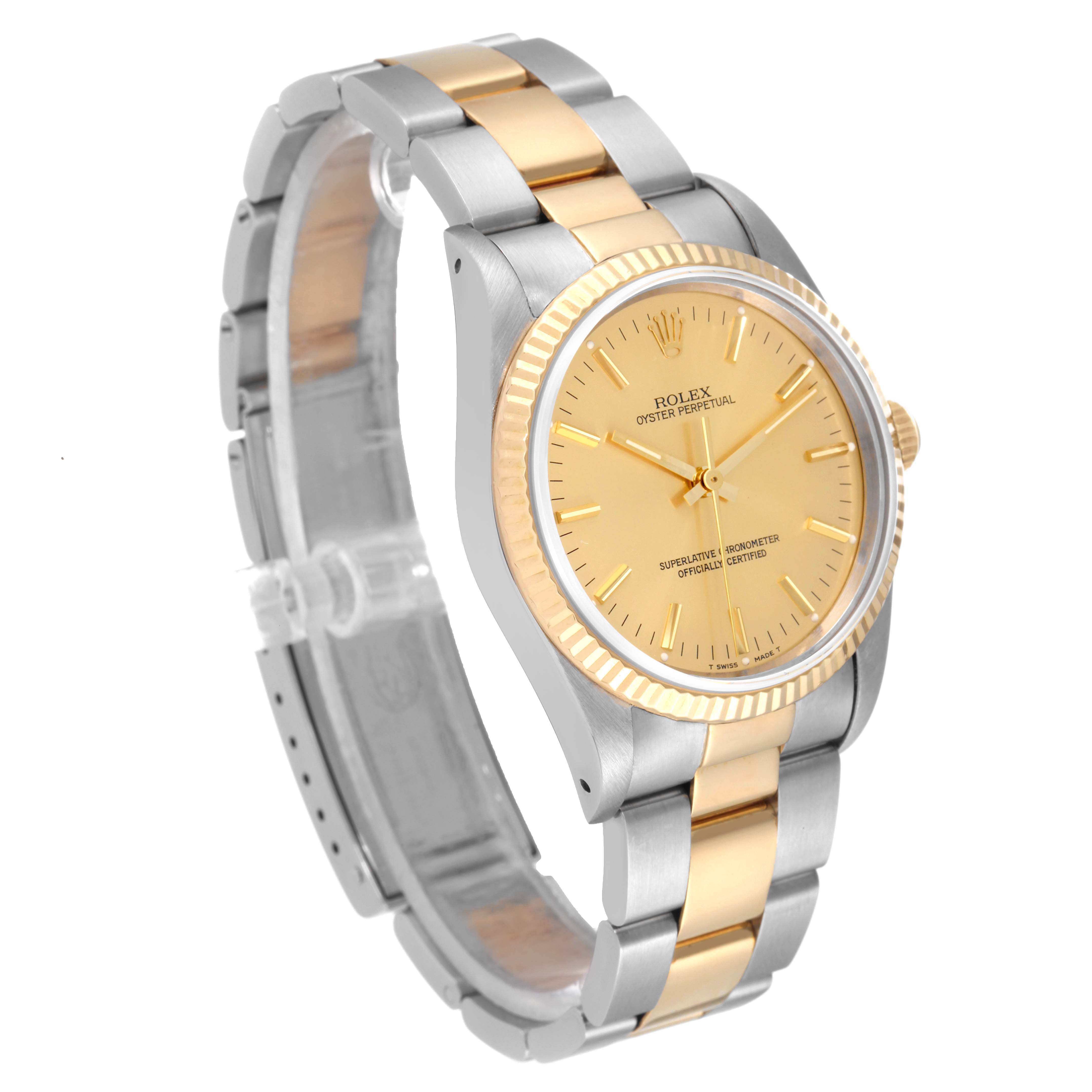 This is a side angle of the Rolex Oyster Perpetual 14233 Men's Steel and Gold (two tone) Champagne Dial 14233 Men's Steel and Gold (two tone) Champagne Dial watch, showing its gold and silver band and bezel.