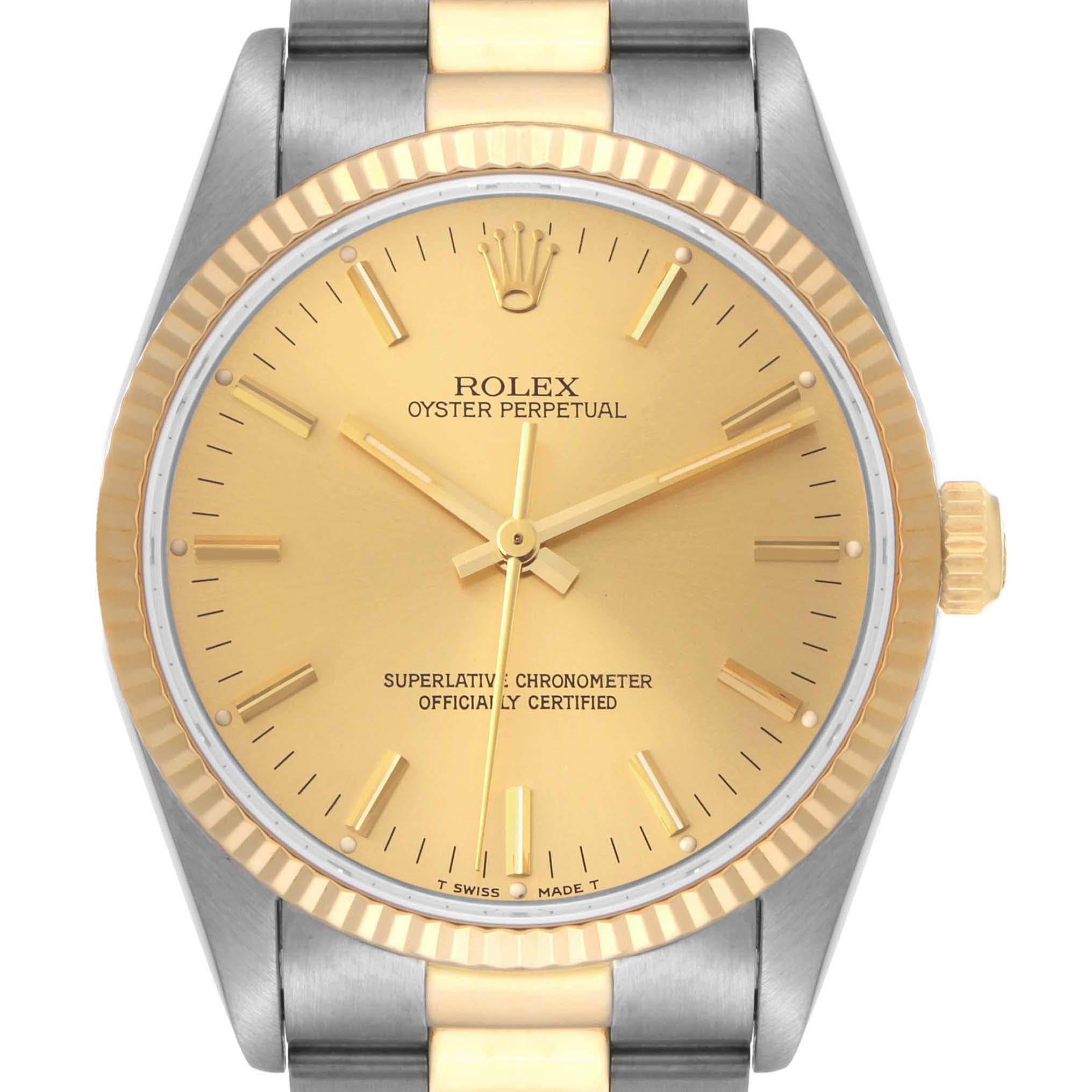 This is a front view of the Rolex Oyster Perpetual 14233 Men's Steel and Gold (two tone) Champagne Dial 14233 Men's Steel and Gold (two tone) Champagne Dial watch, showing its gold dial, bezel, and part of the bracelet.