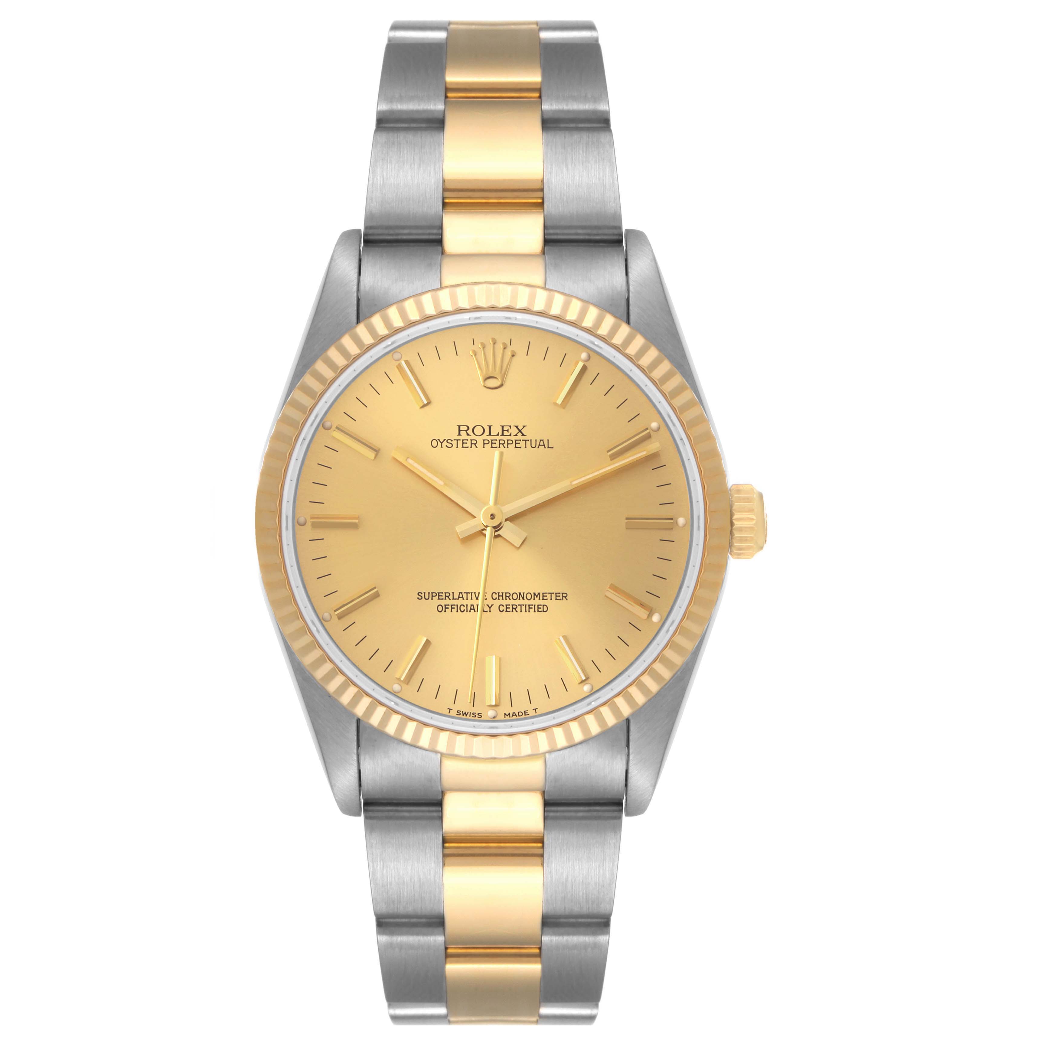 This image shows a front view of a Rolex Oyster Perpetual 14233 Men's Steel and Gold (two tone) Champagne Dial 14233 Men's Steel and Gold (two tone) Champagne Dial watch, featuring a two-tone gold and silver design.