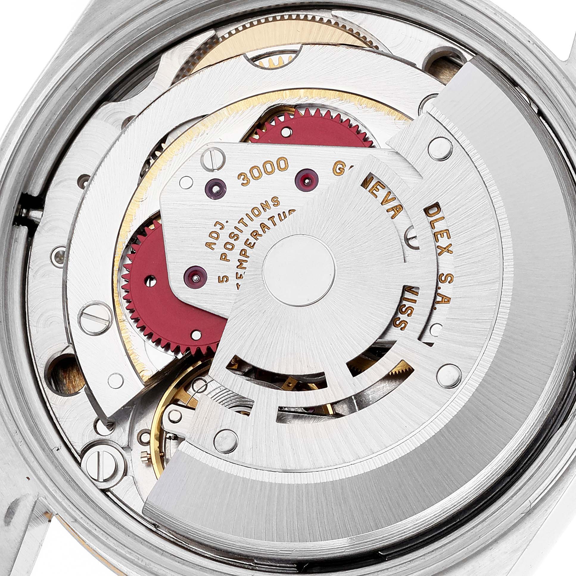 This image shows the intricate internal mechanical movements of a Rolex Oyster Perpetual 14203 Men's Steel and Gold (two tone) Grey Dial 14203 Men's Steel and Gold (two tone) Grey Dial watch from a close-up angle.