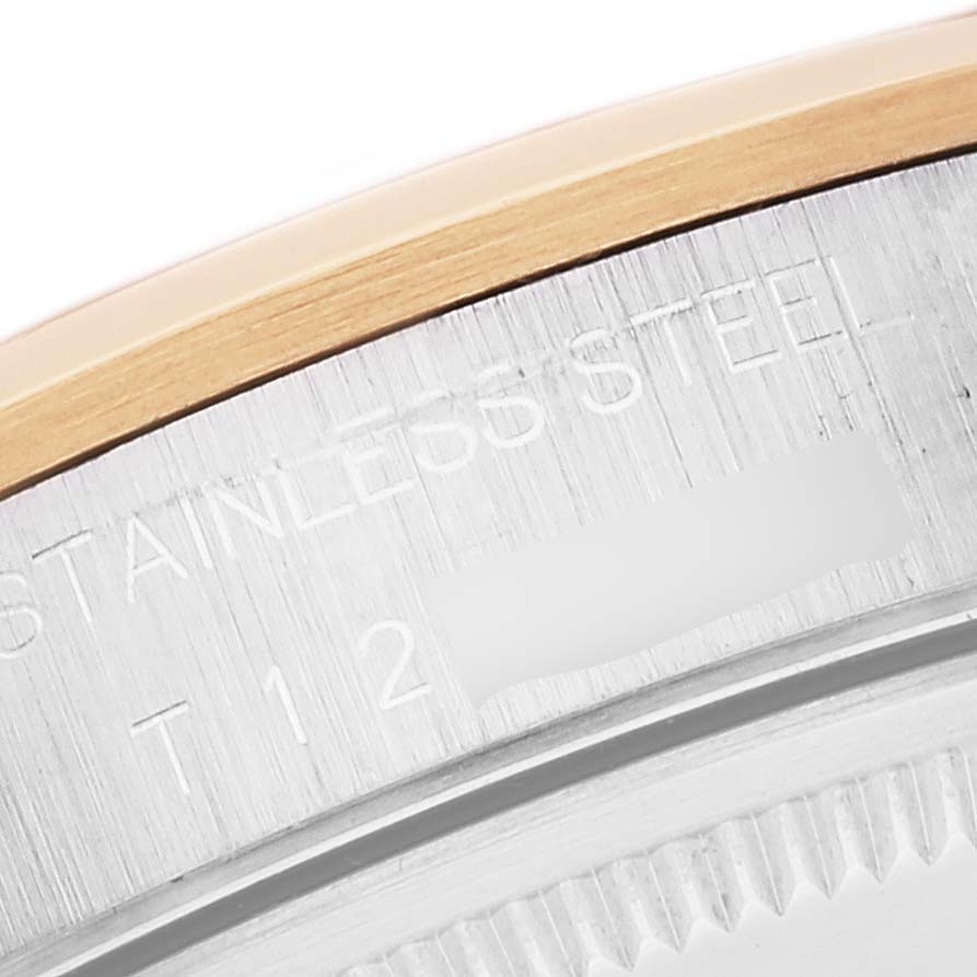 This close-up image focuses on the side bezel and case back engraving of a Rolex Oyster Perpetual 14203 Men's Steel and Gold (two tone) Grey Dial 14203 Men's Steel and Gold (two tone) Grey Dial watch.