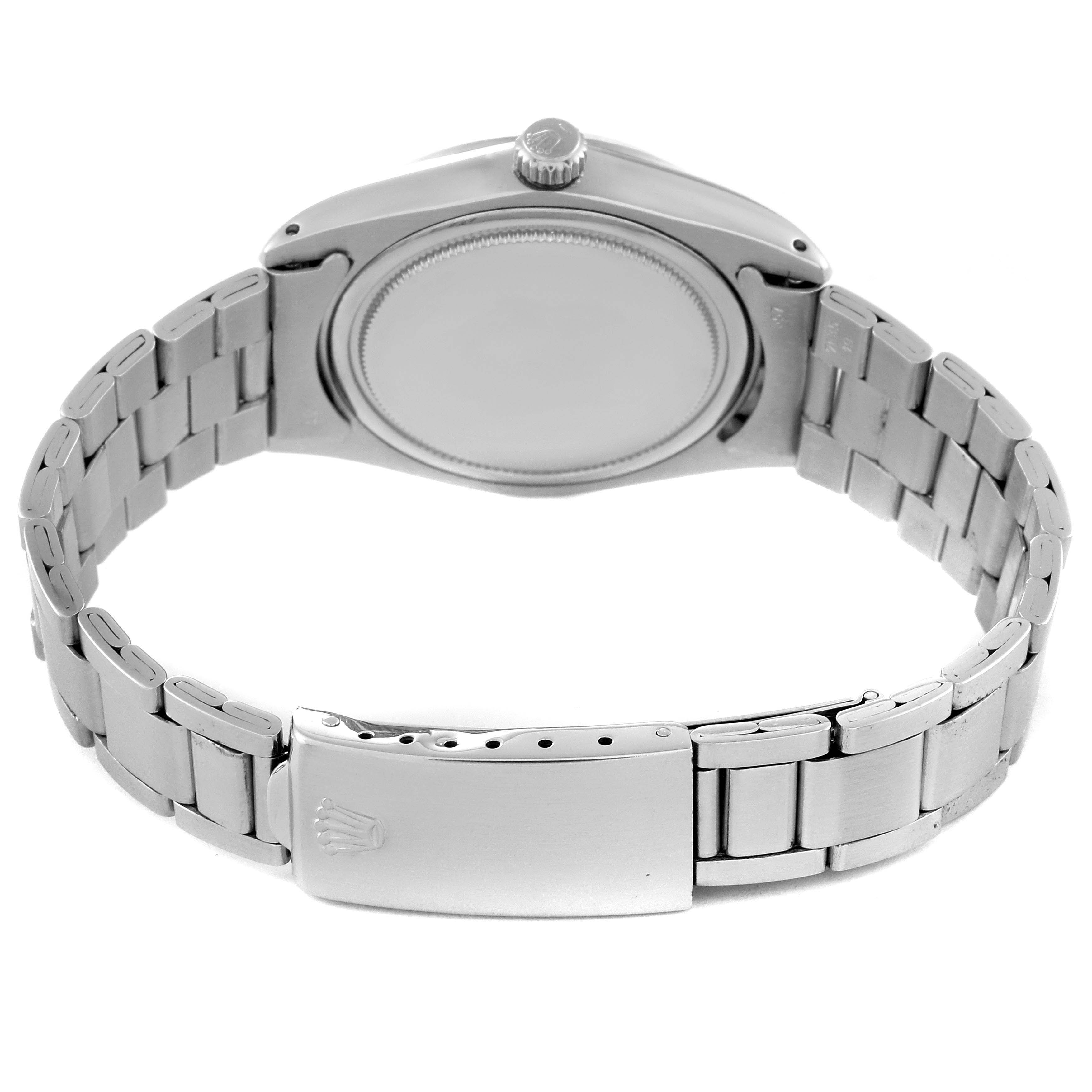 The image shows the back view of the Rolex Vintage Collection 6694 Men's Stainless Steel Silver Dial 6694 Men's Stainless Steel Silver Dial watch with the clasp and bracelet fully visible.