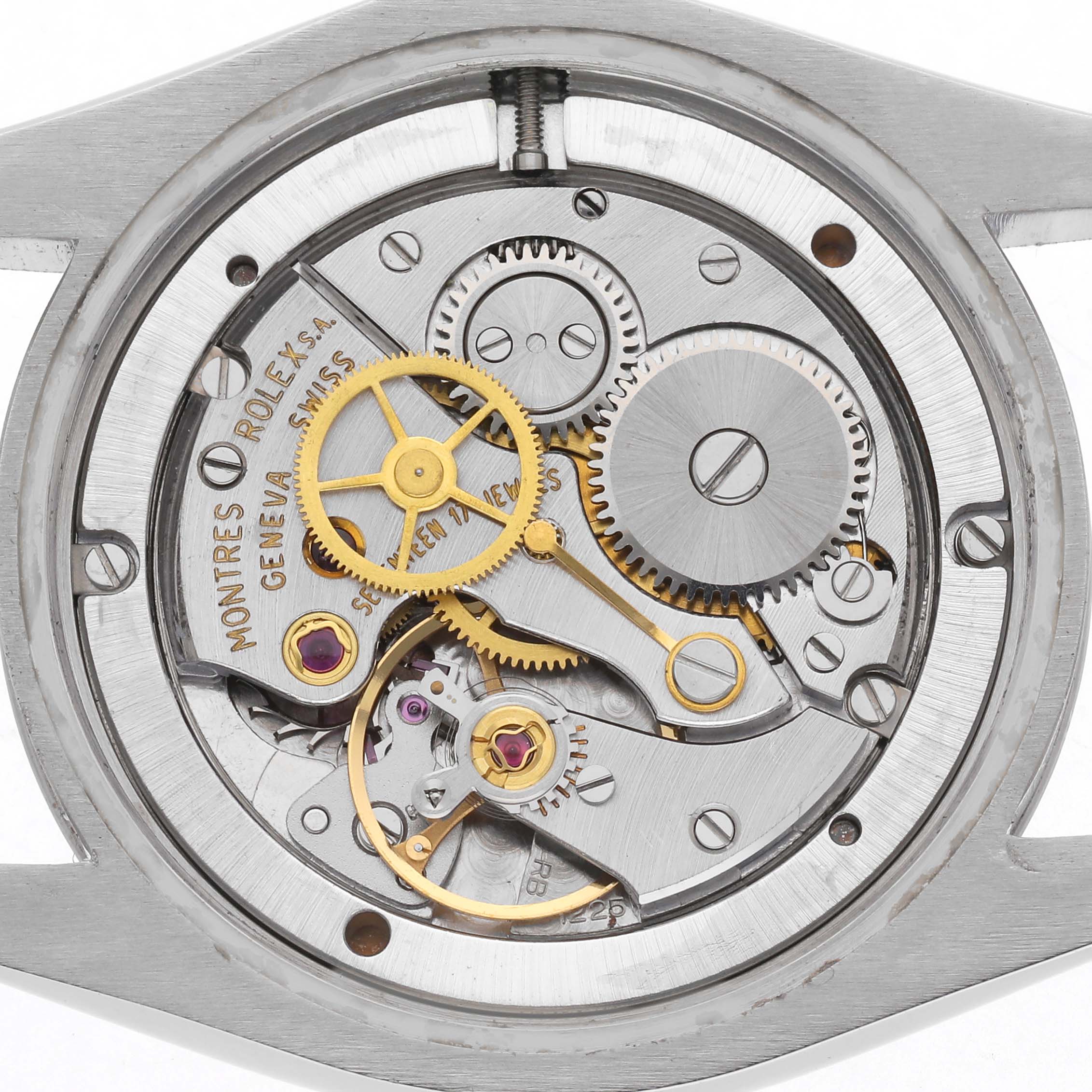 The image shows the internal movement of a Rolex Vintage Collection 6694 Men
s Stainless Steel Silver Dial 6694 Men
s Stainless Steel Silver Dial watch, highlighting gears and mechanical components.