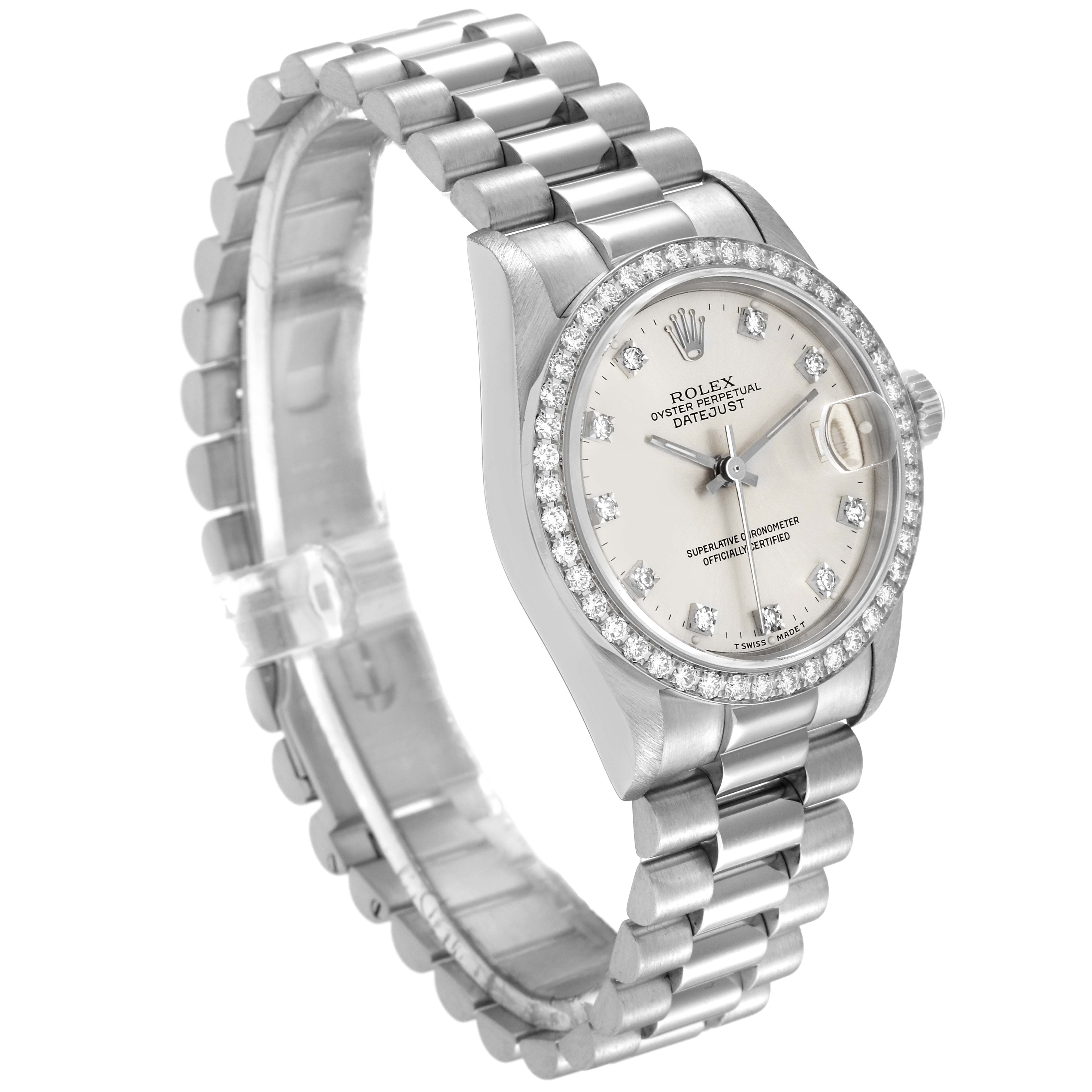 The President model Rolex watch is shown at an angle displaying the face, bezel, and bracelet.