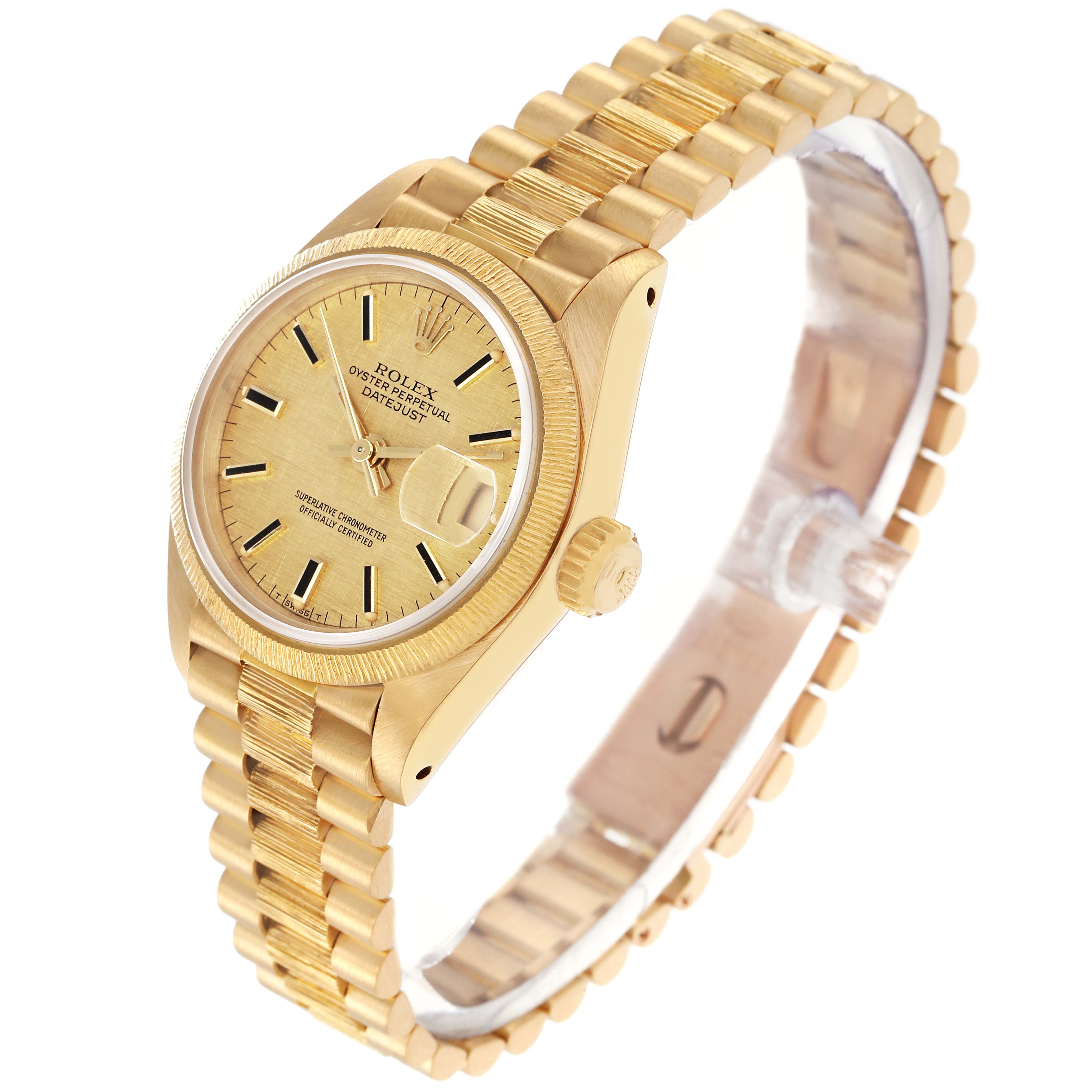 The Rolex Datejust 69278 Women's Yellow Gold Champagne Dial 69278 Women's Yellow Gold Champagne Dial is shown at a tilted angle, displaying its face, bezel, crown, and part of the bracelet.
