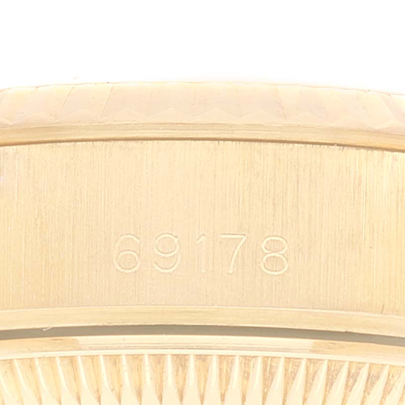 This close-up photo shows the serial number "69178" engraved on the side of a Rolex President 69178 Women
s Yellow Gold Champagne Dial 69178 Women
s Yellow Gold Champagne Dial model watch.
