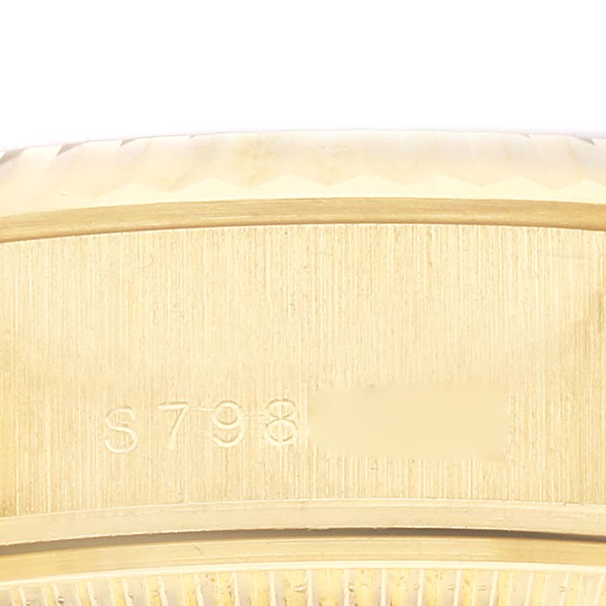 The close-up image shows the side of the Rolex President 69178 Women's Yellow Gold Champagne Dial 69178 Women's Yellow Gold Champagne Dial watch case and part of the serial number.