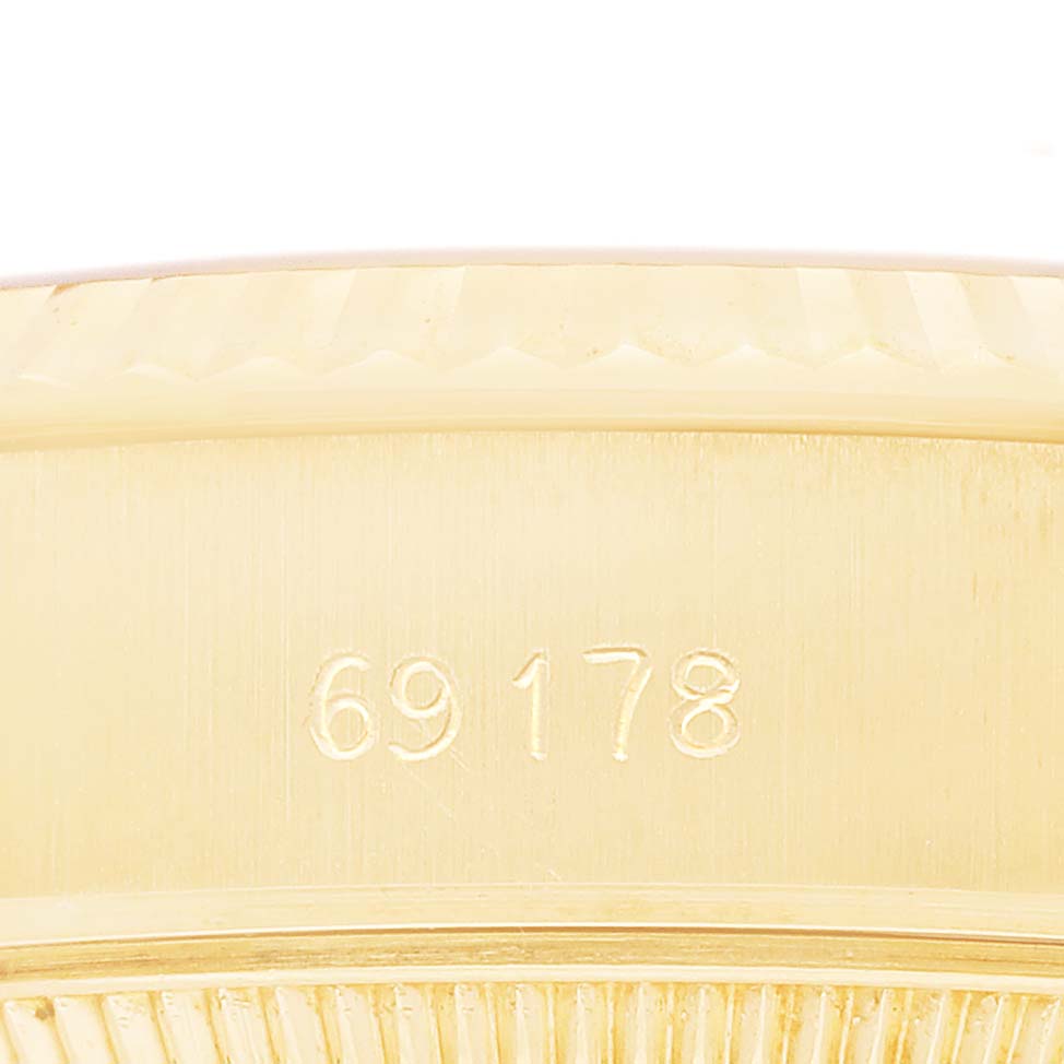 The image shows a close-up of the side of a Rolex President 69178 Women's Yellow Gold White Dial model watch with the reference number 69178 engraved.