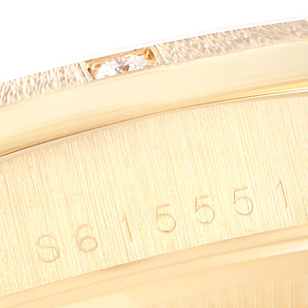This image shows a close-up of the serial number and diamond detail on the bezel of a Rolex President 18308 Men
s Yellow Gold Champagne Dial 18308 Men
s Yellow Gold Champagne Dial model watch.