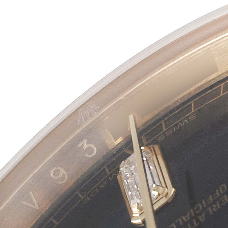 This close-up image of the Rolex President 118238 Men's Yellow Gold Black Dial 118238 Men's Yellow Gold Black Dial model watch shows part of the dial, with hour markers and part of the bezel.