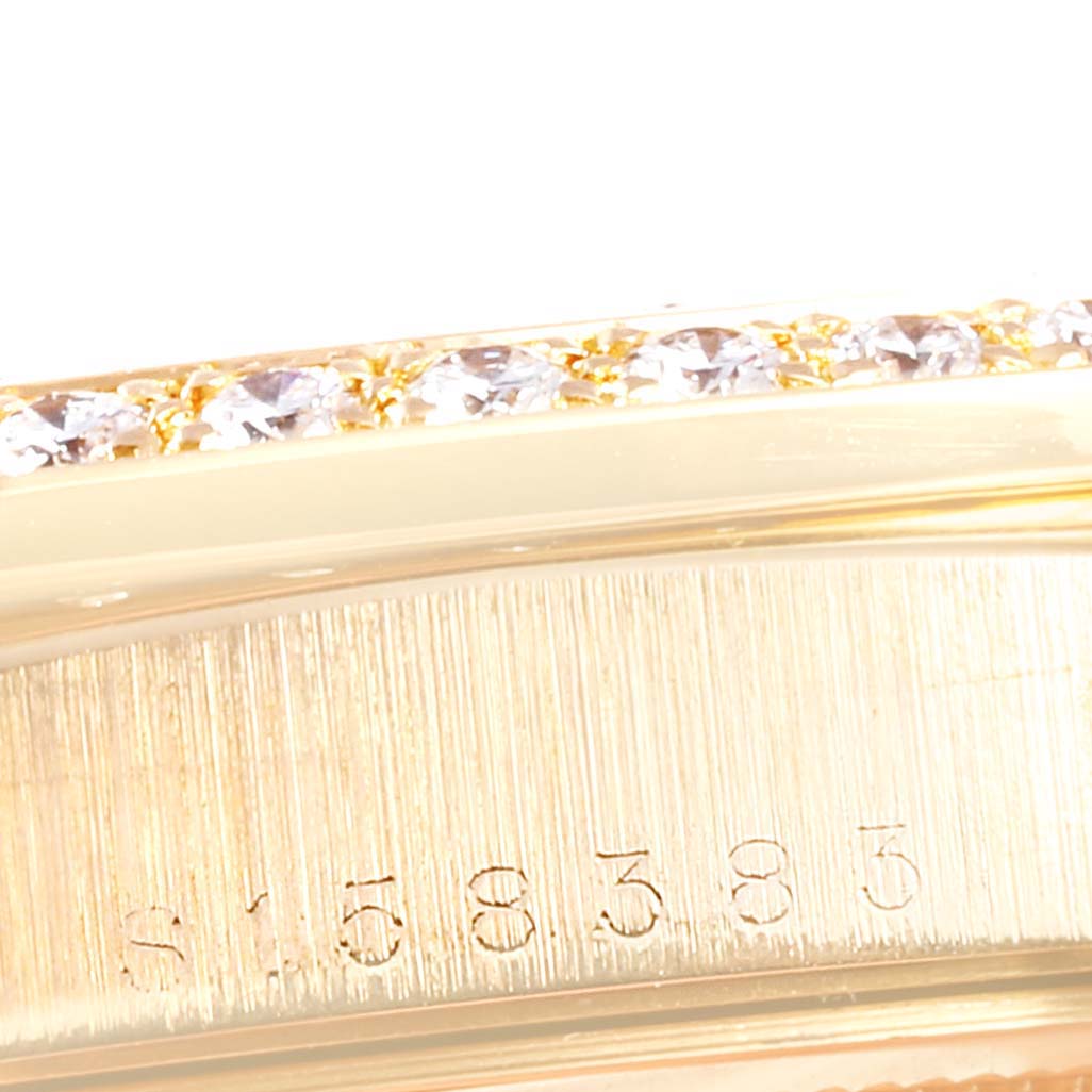 This close-up image shows a portion of the bezel with embedded diamonds and casing of the Rolex President 18238 Men
s Yellow Gold Champagne Dial 18238 Men
s Yellow Gold Champagne Dial model watch.