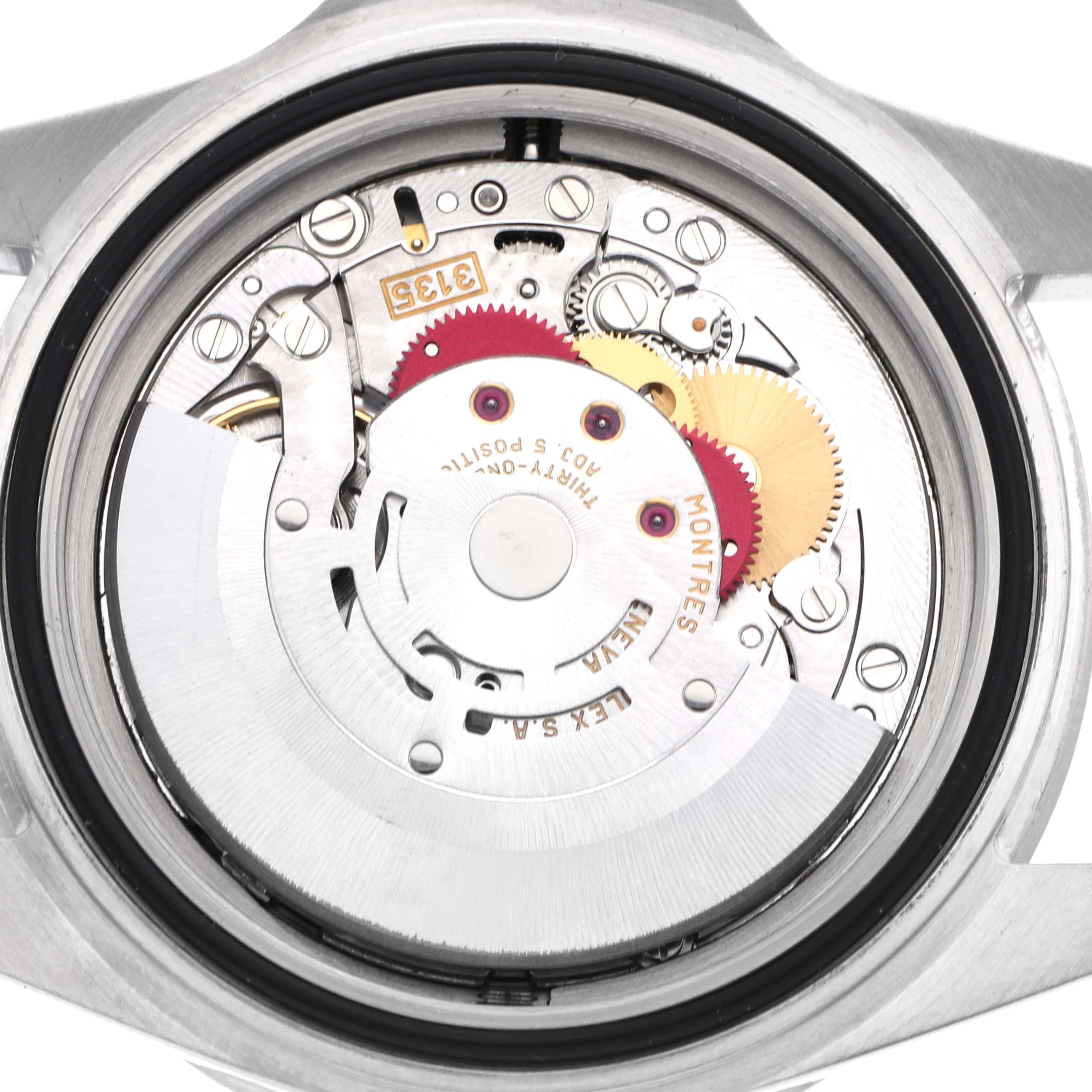 The image shows the back of a Rolex Sea-Dweller 16600 Men
s Stainless Steel Black Dial 16600 Men
s Stainless Steel Black Dial, highlighting its intricate movement and internal mechanics.