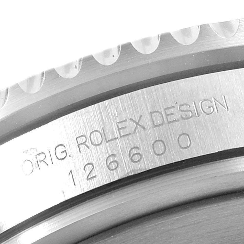 The image shows a close-up of the side engraving on a Rolex Sea-Dweller 126600 Men's Stainless Steel Black Dial watch, featuring "ORIG. ROLEX DESIGN" and the model number 126600.