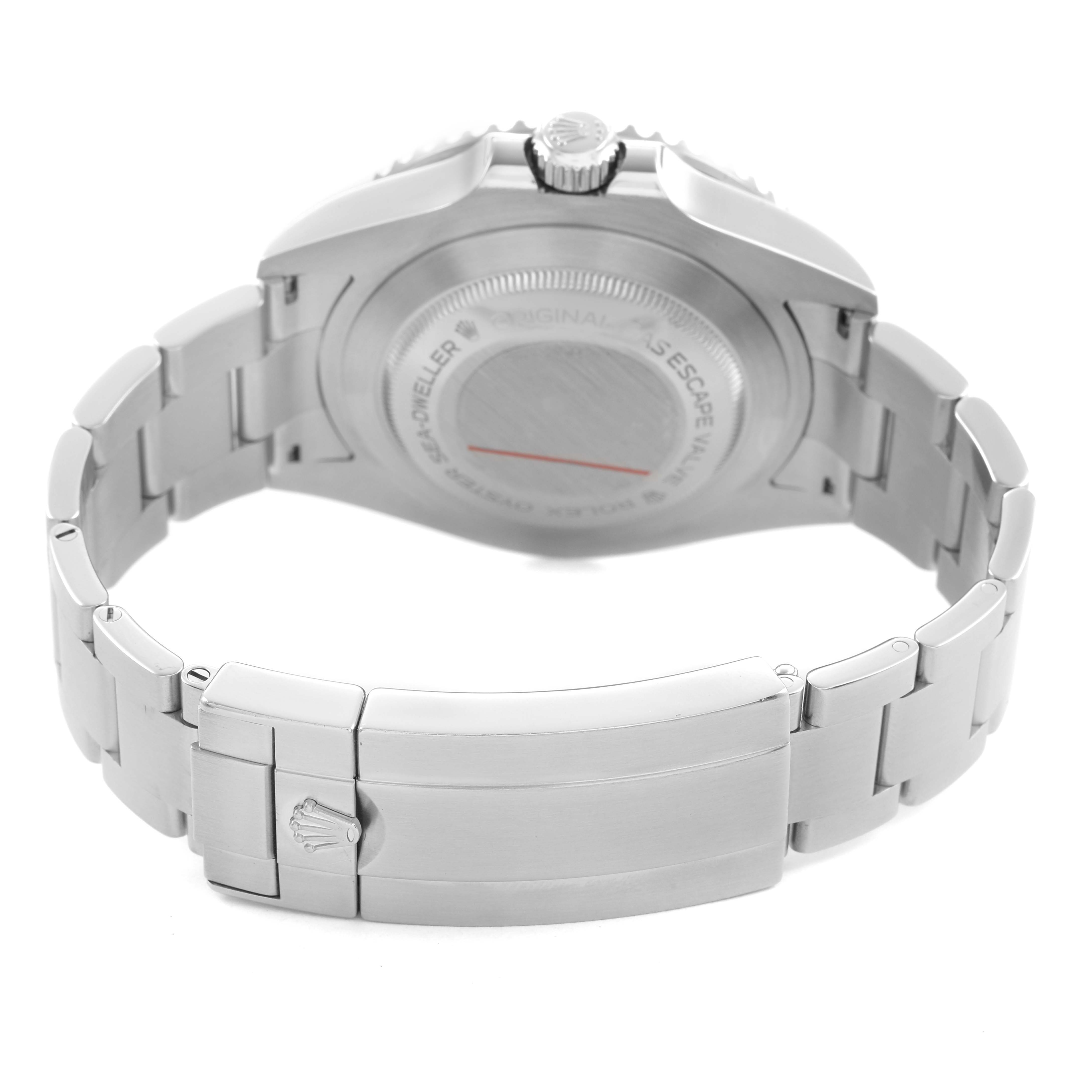 The Rolex Sea-Dweller 126600 Men's Stainless Steel Black Dial is shown from a rear angle, highlighting the case back, crown, and bracelet clasp.