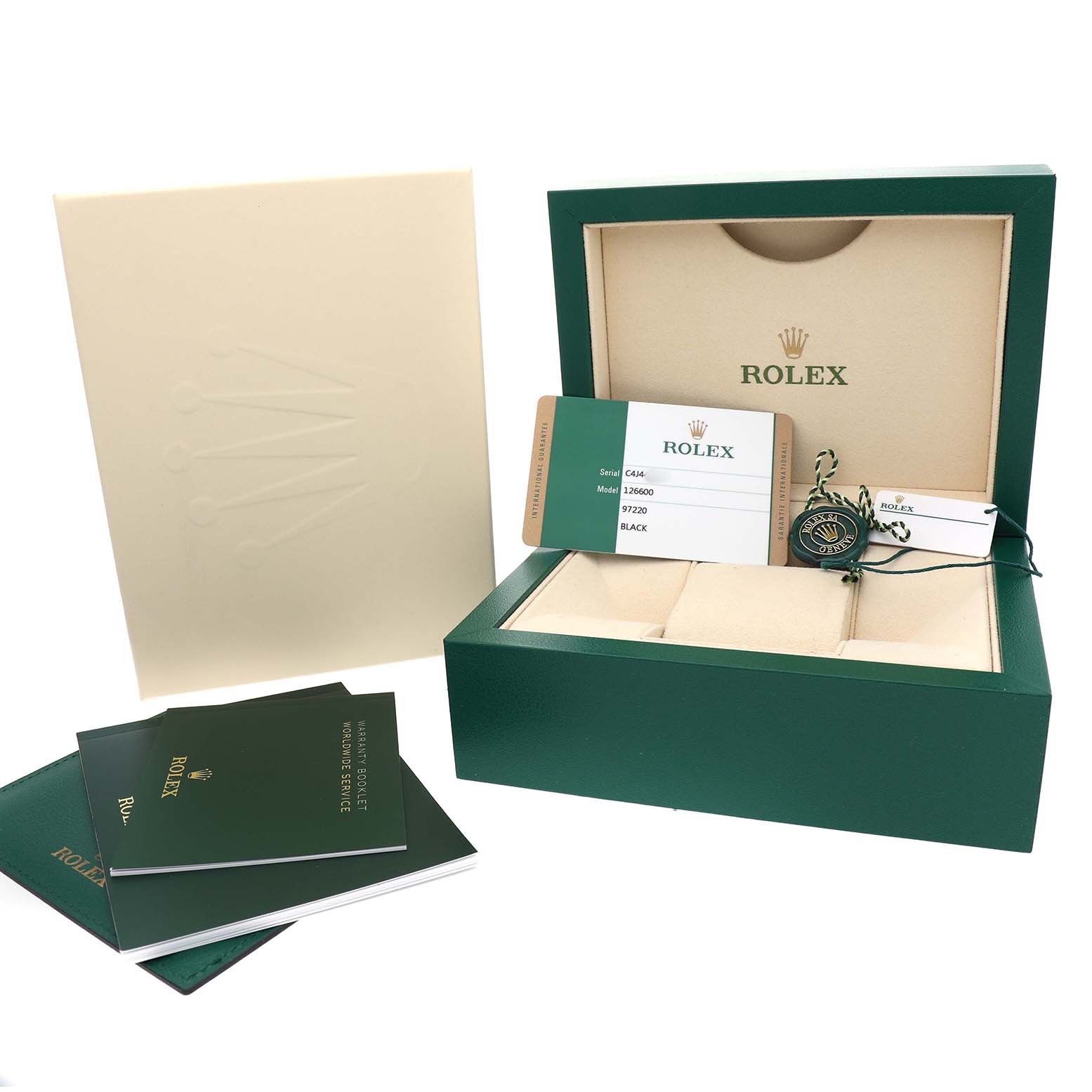 The image shows the box and accessories for a Rolex Sea-Dweller 126600 Men's Stainless Steel Black Dial, including a tag, warranty card, and booklets.