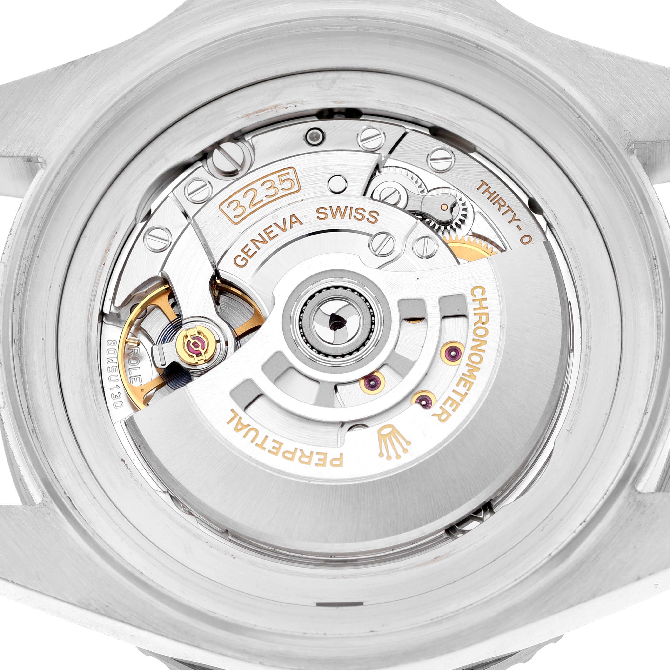 The image shows the movement of a Rolex Sea-Dweller 126660 Men's Stainless Steel Blue Dial watch, viewed from the back, highlighting its intricate mechanics.