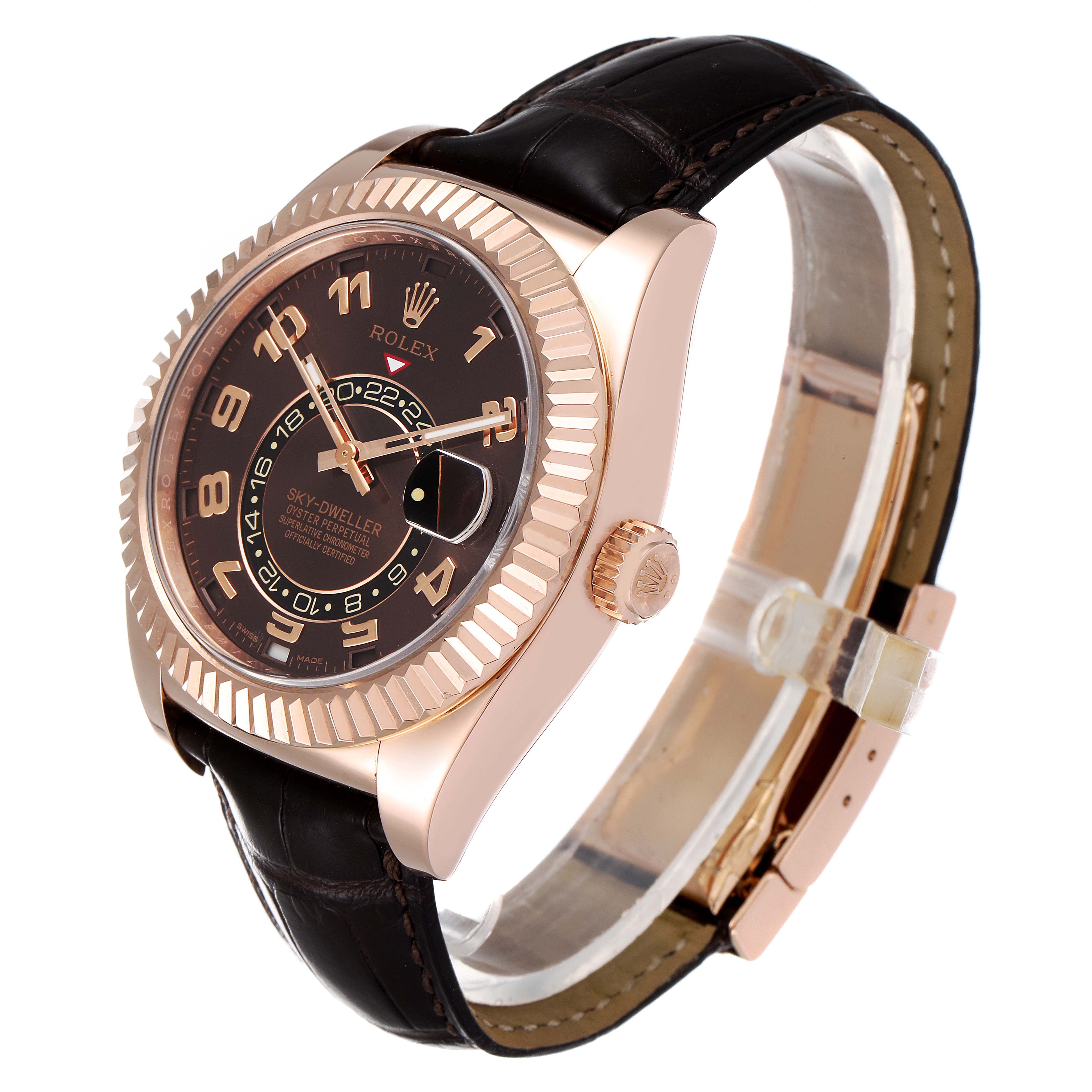 The Rolex Sky-Dweller 326135 Men's Rose Gold Brown Dial 326135 Men's Rose Gold Brown Dial watch is shown at an angle, highlighting its bezel, dial, crown, and leather strap.