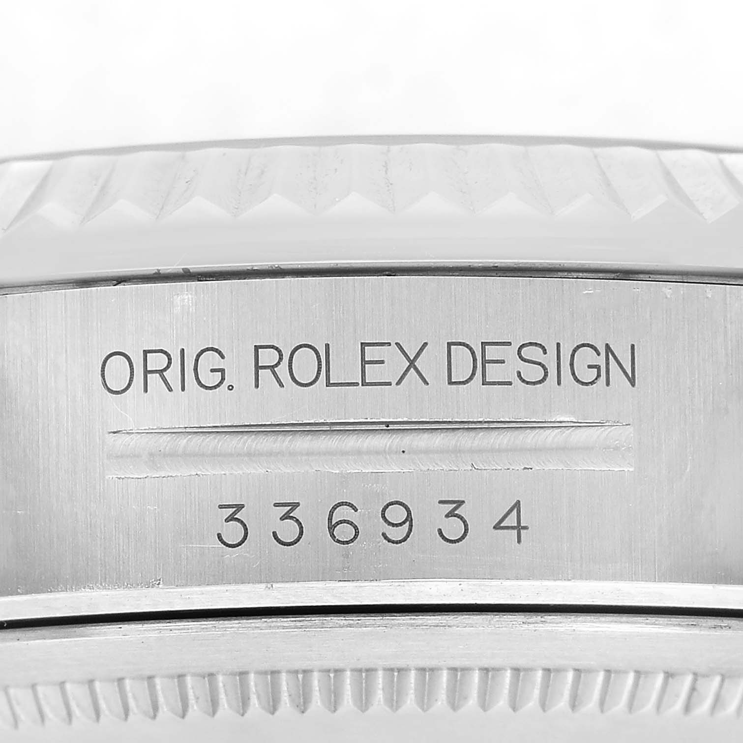 The image shows a close-up of the case side of a Rolex Sky-Dweller 336934 Men's Stainless Steel Blue Dial, highlighting the "Orig. Rolex Design" engraving and serial number.