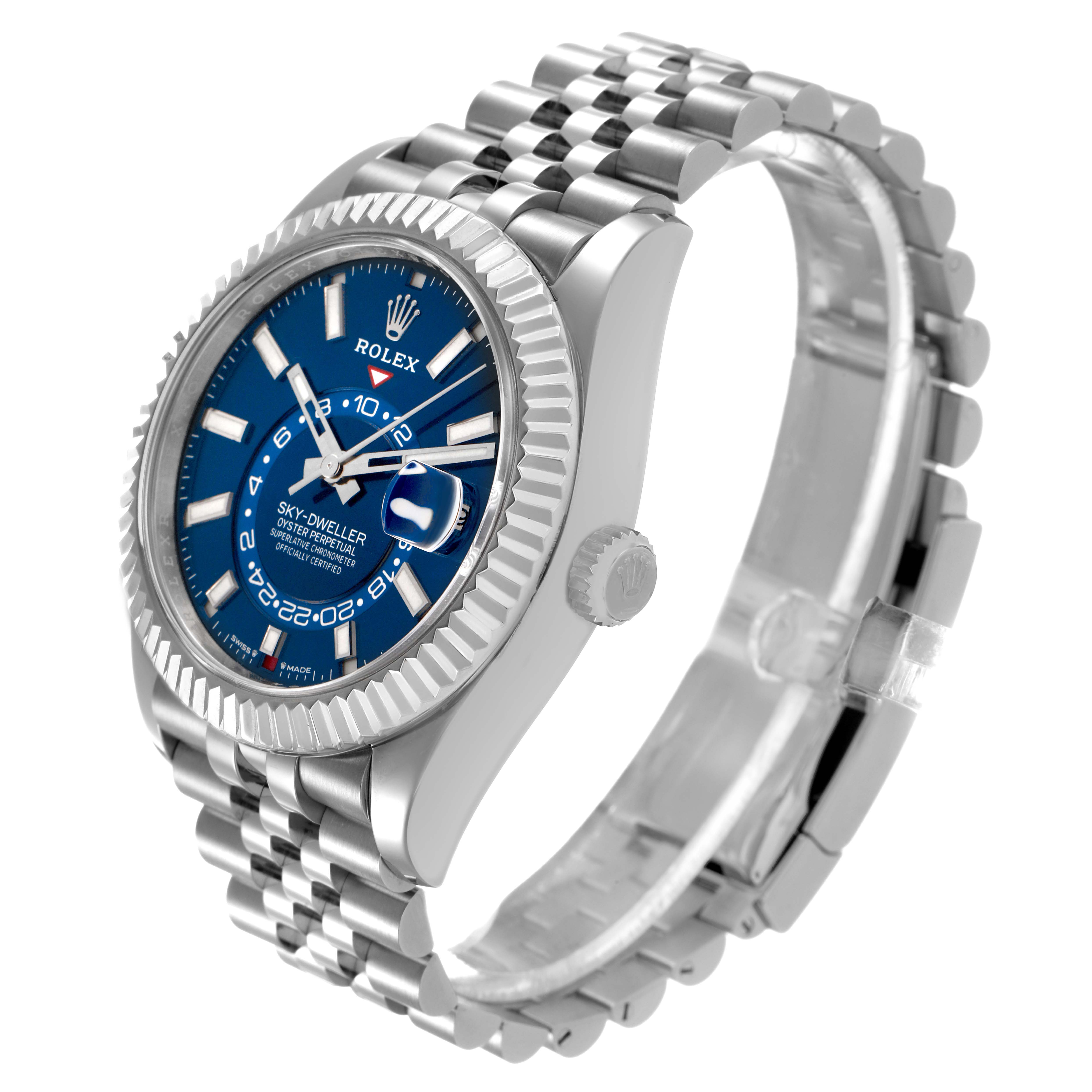 The Rolex Sky-Dweller 336934 Men's Stainless Steel Blue Dial watch is shown at a three-quarter angle, highlighting the blue dial, fluted bezel, and Jubilee bracelet.